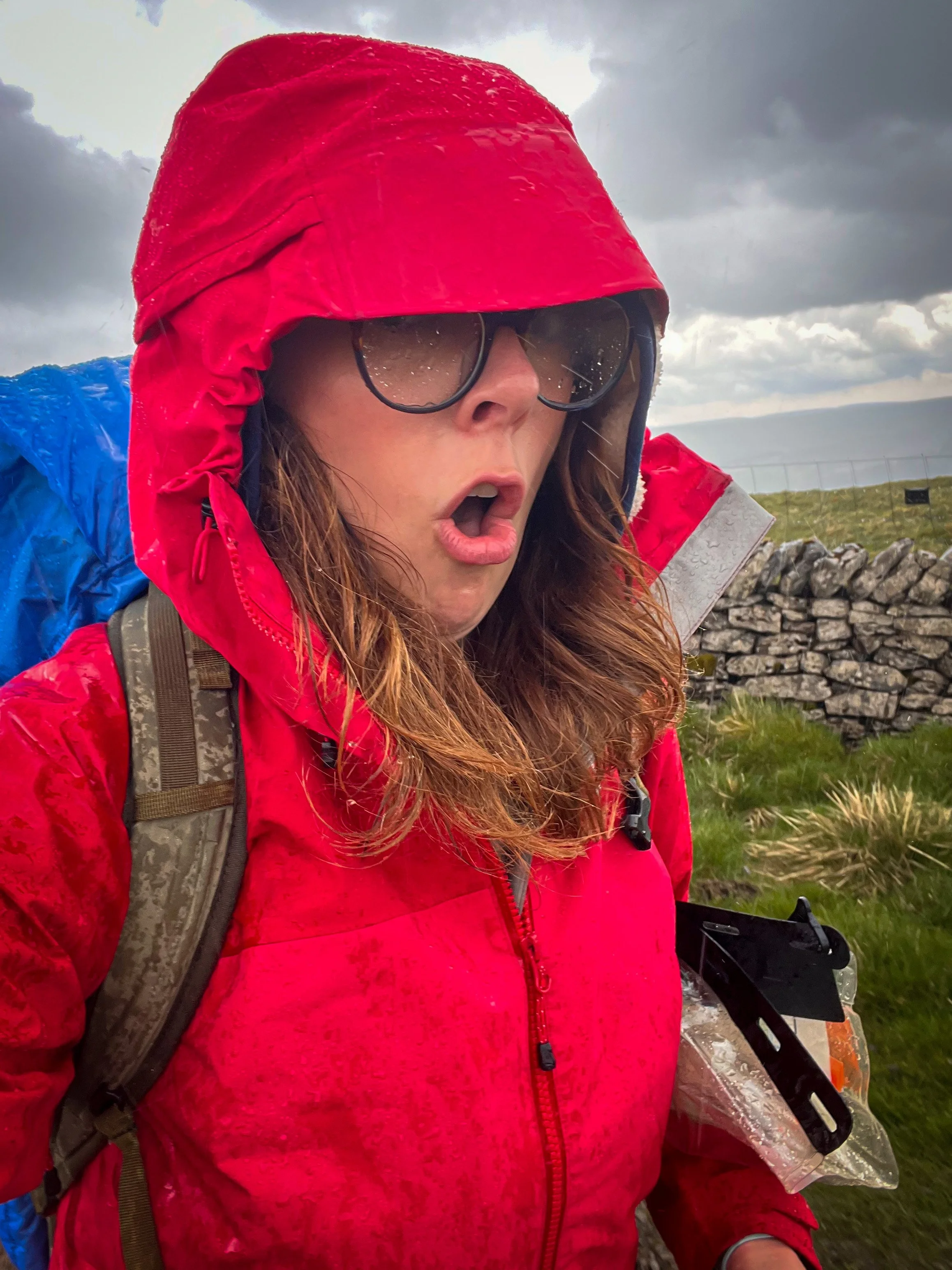 Me standing in red coat in the rain