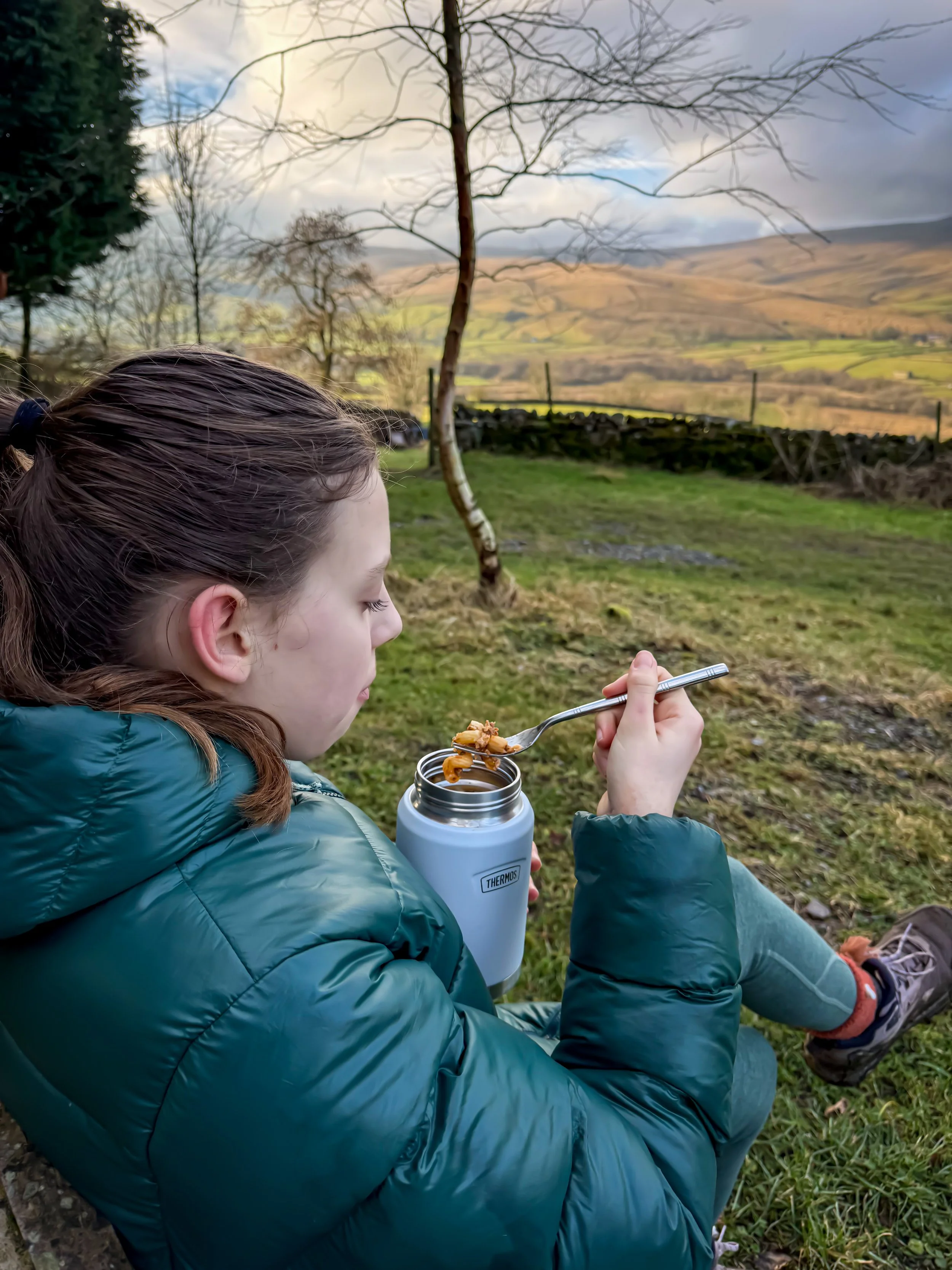 Eating a hot picnic in winter on a bench with views