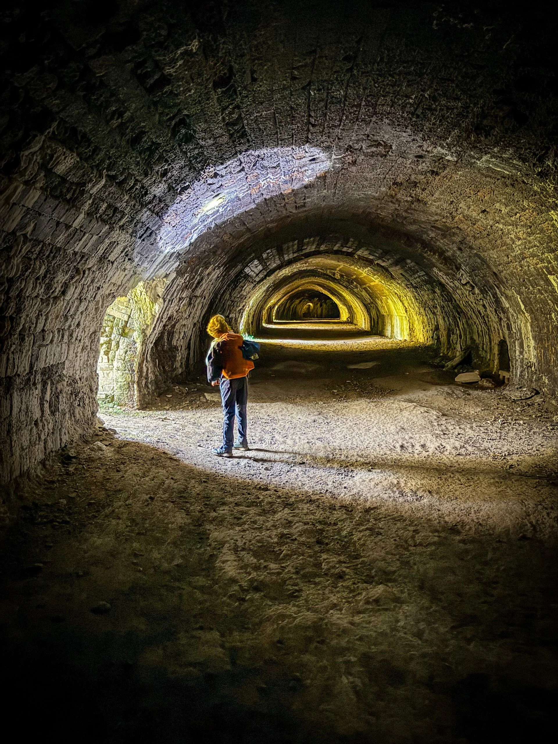 Checking out the inside of the Hoffman Kiln child with a torch