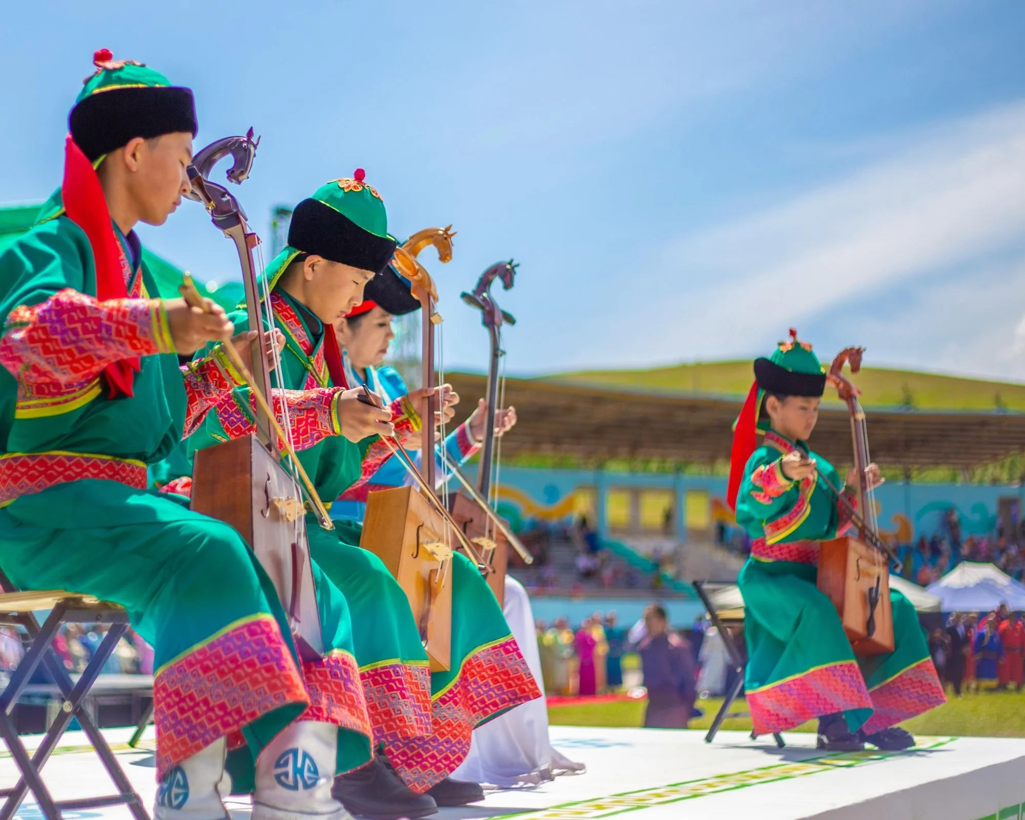 Traditional Mongolian Musicians Perform Outdoors.jpg