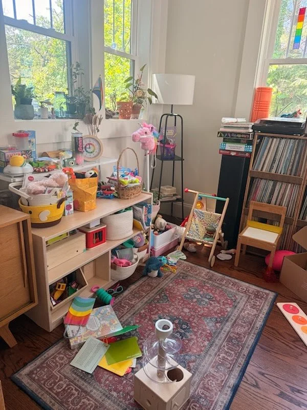 Toy area before a quarterly home organization reset, showing clutter common in ADHD family homes