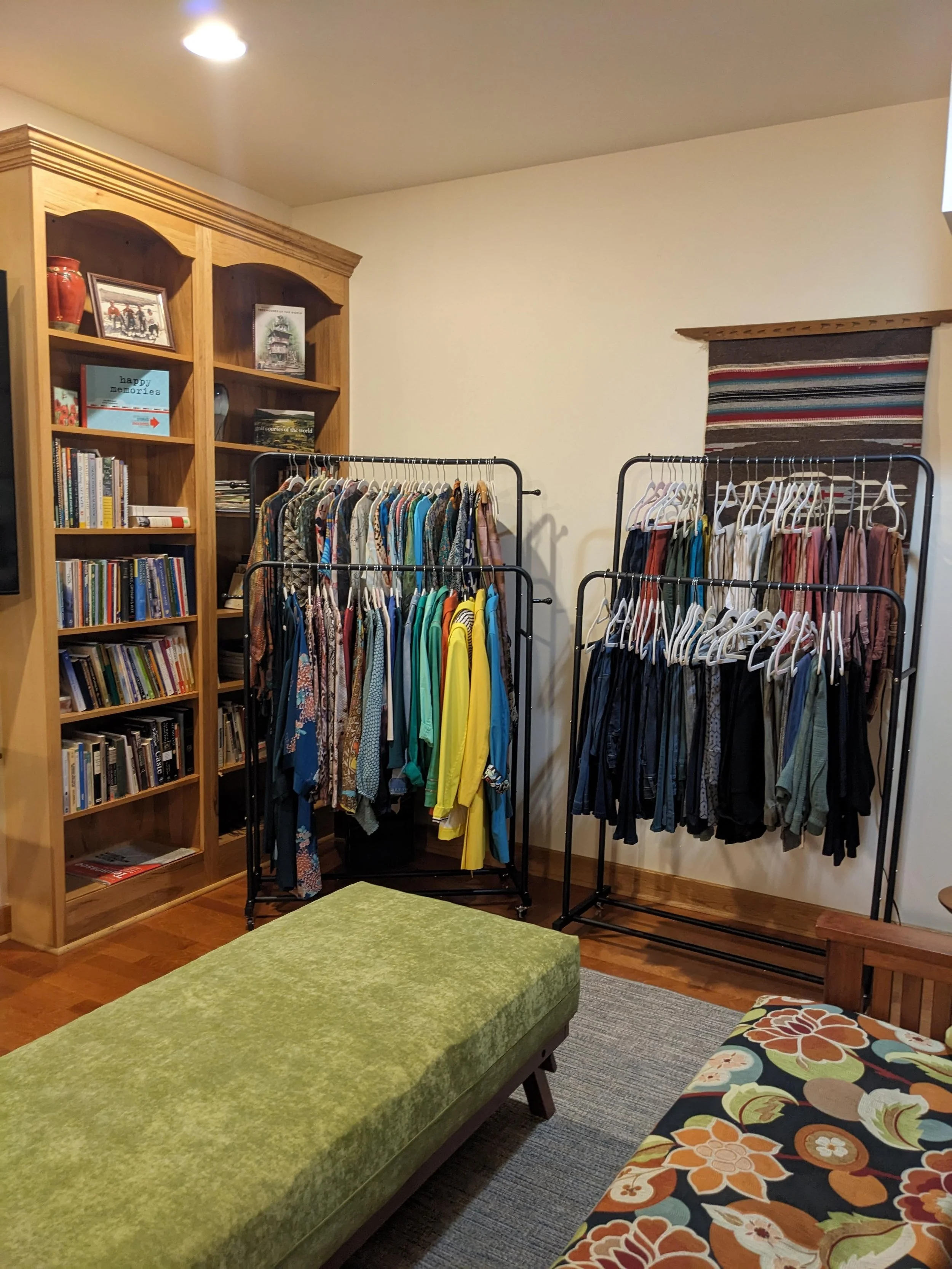 Organized clothes on clothing racks while renovation is happening
