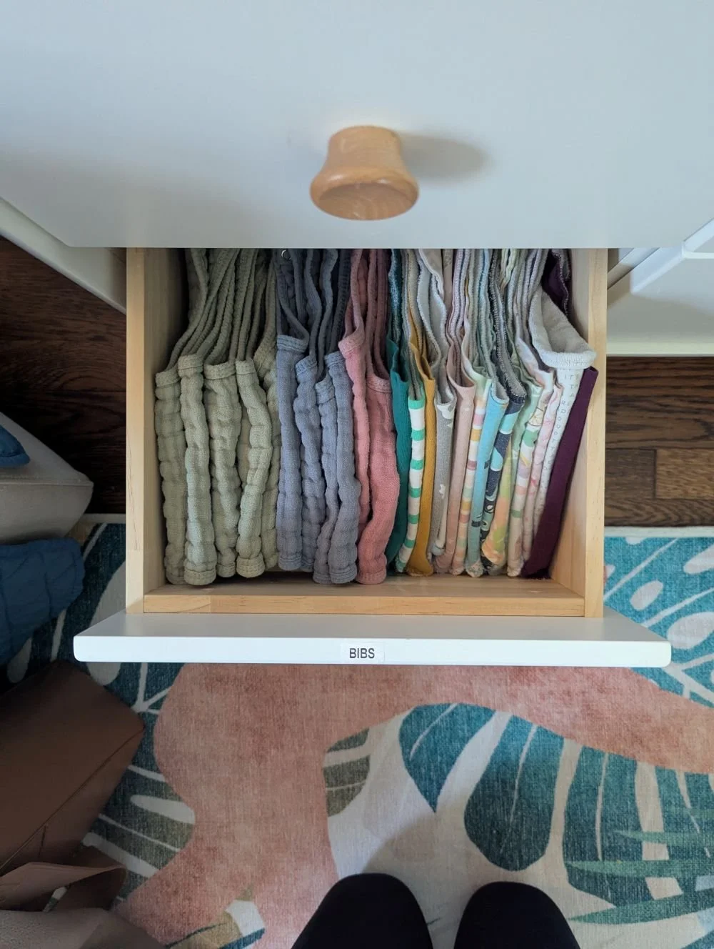 Toddler clothing organized during a quarterly membership reset, with sizes swapped and simplified