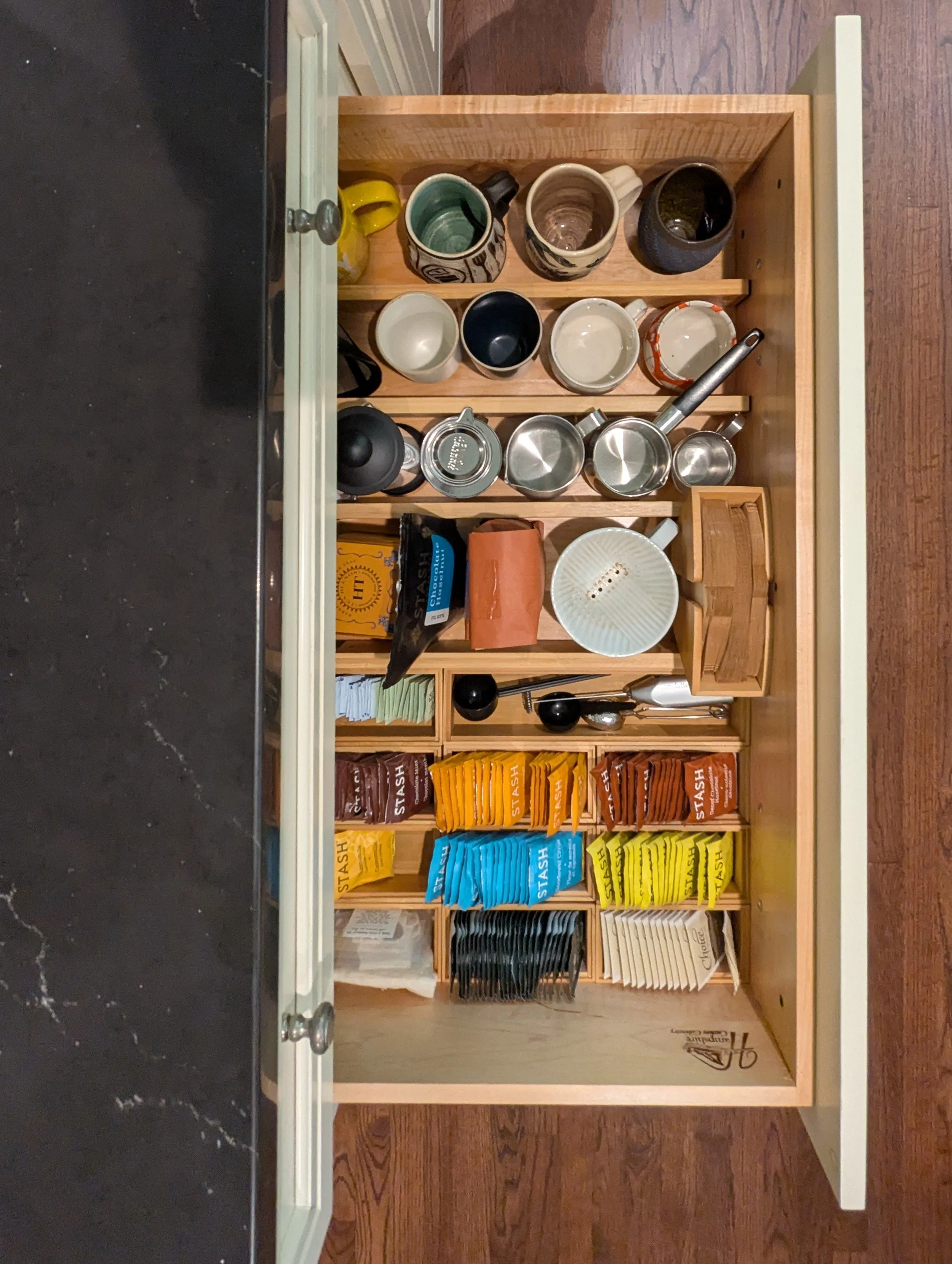 Decluttering and organizing kitchen drawers before house is listed to sell Asheville NC