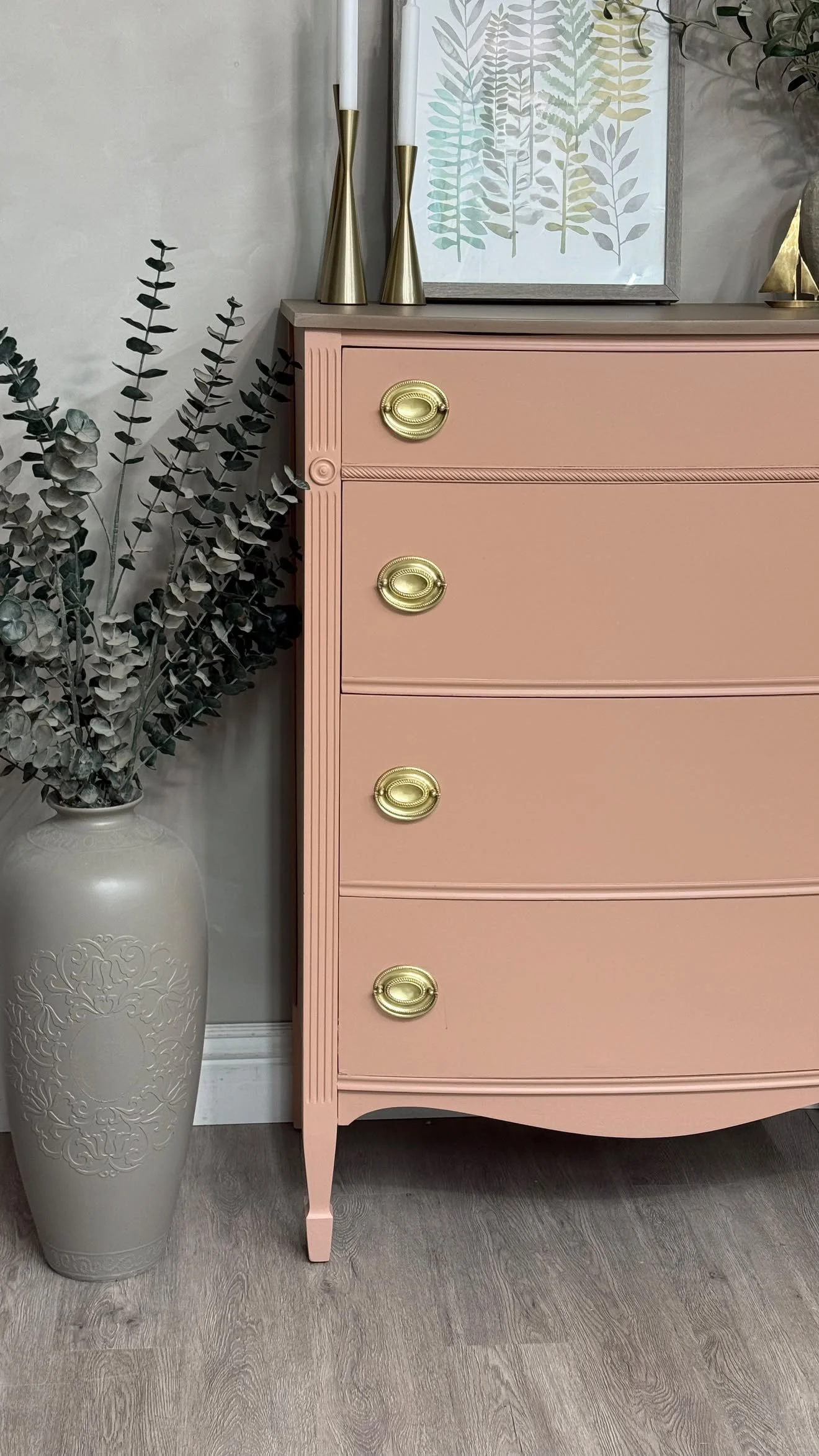 Vintage four-drawer dresser painted in Sophie’s Pink by Mélange Paints, featuring antique brass hardware, refinished by Olive Street Designs.