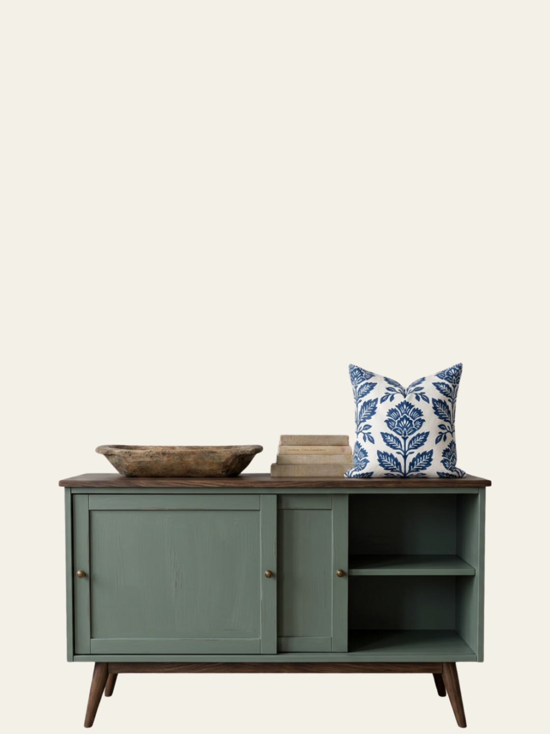 A mid-century modern green wooden painted sideboard finished with Mélange Paints furniture paint in Greymere, a moody blue-green color.