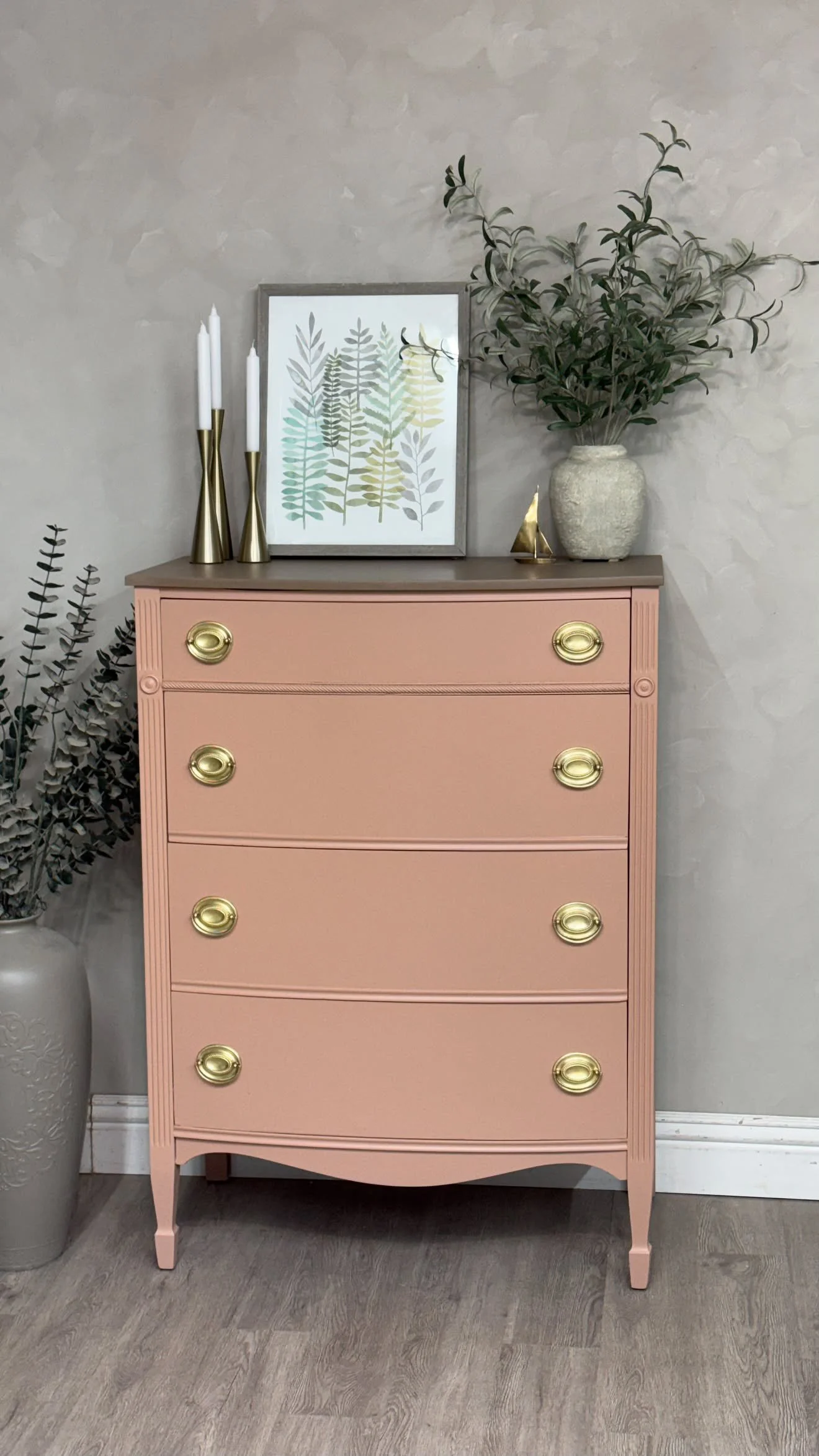 Vintage four-drawer dresser painted in Sophie’s Pink by Mélange Paints, featuring antique brass hardware, refinished by Olive Street Designs.