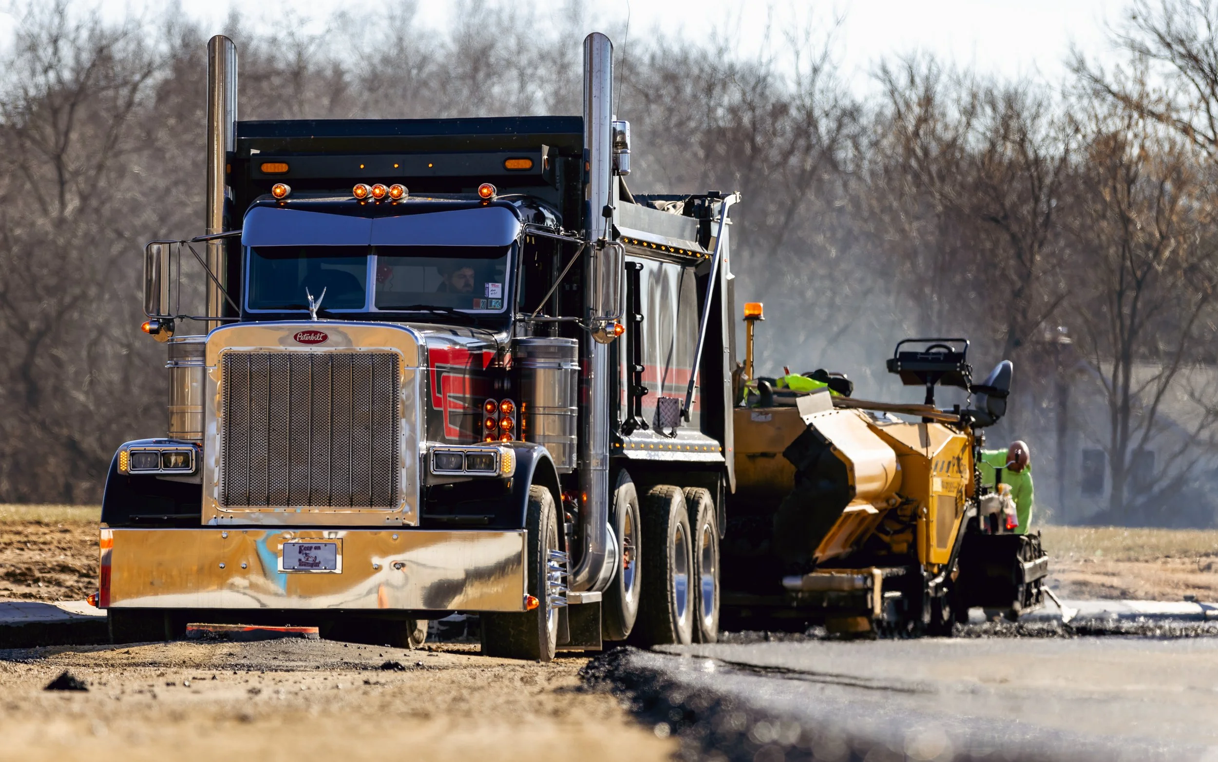 Asphalt blacktop being placed at our Brandywine Farms project.