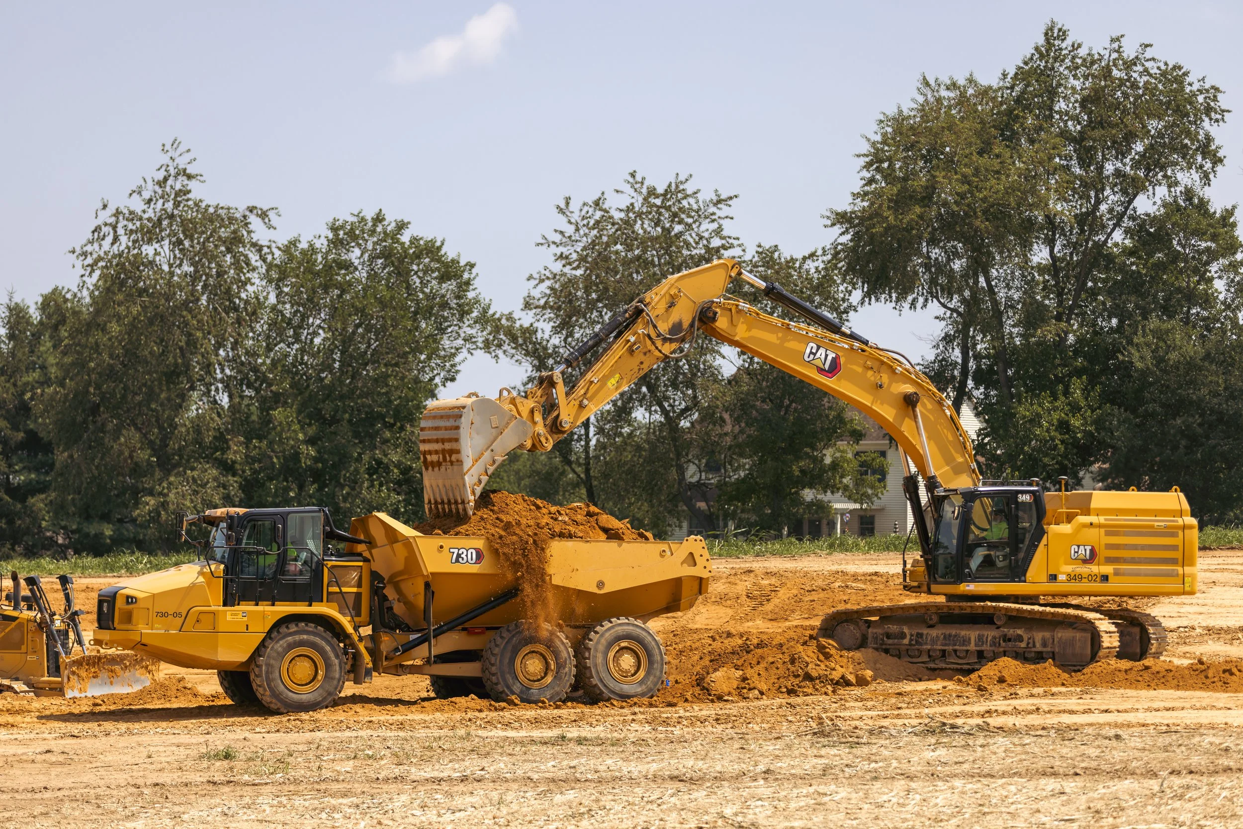 CAT 349 loading a CAT 730 dump truck at the Brandywine Farms project