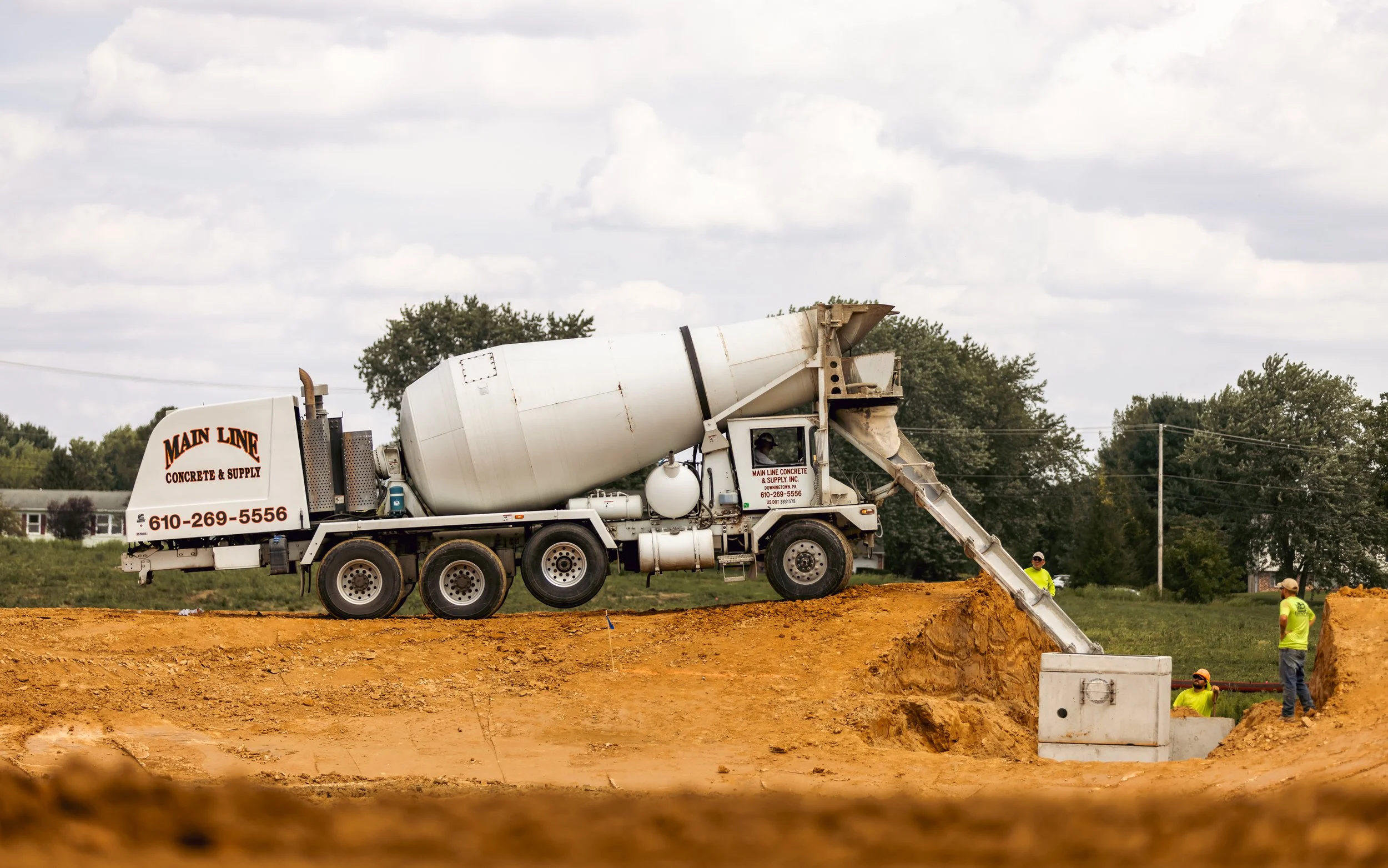 Mainline Concrete delivering concrete for a basin outlet at the Brandywine Farms project for Traditions of America