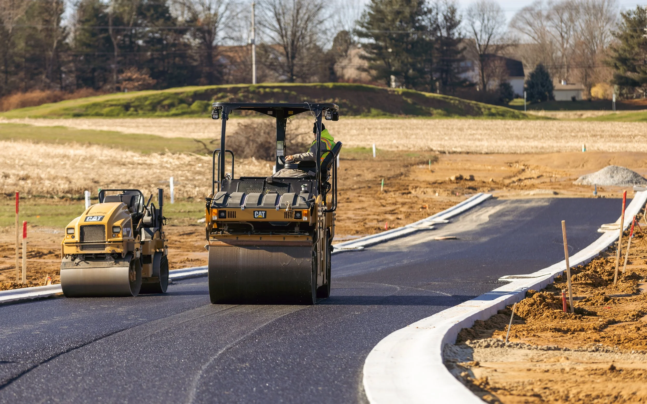 Asphalt blacktop being placed at our Brandywine Farms project.