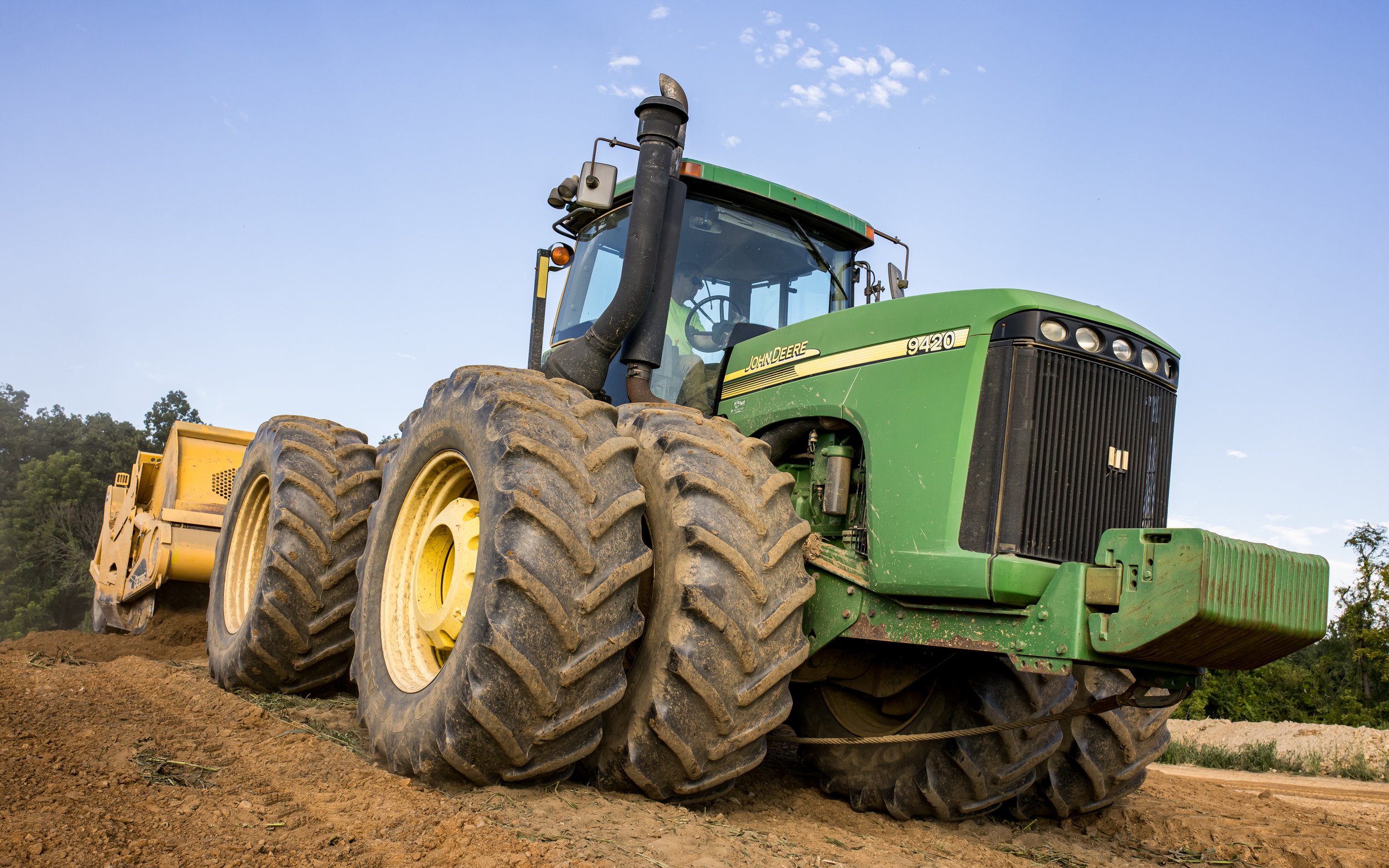 Our John Deere tractor pans stockpiling topsoils at the Brandywine Farms project