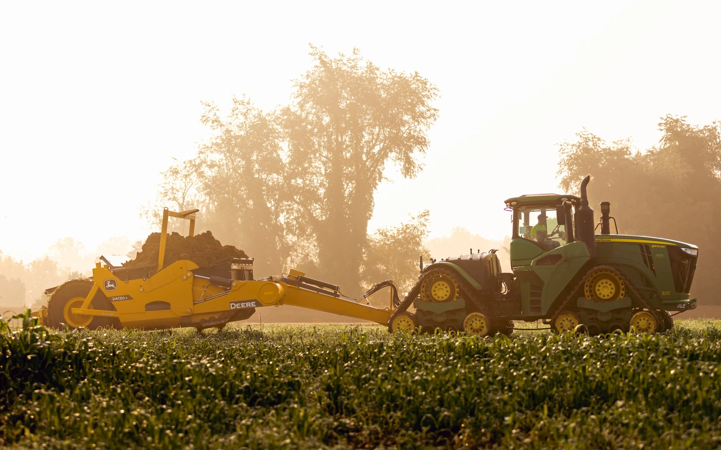 John Deere Tractor Scraper stripping topsoil at the Brandywine Farms project for Traditions of America
