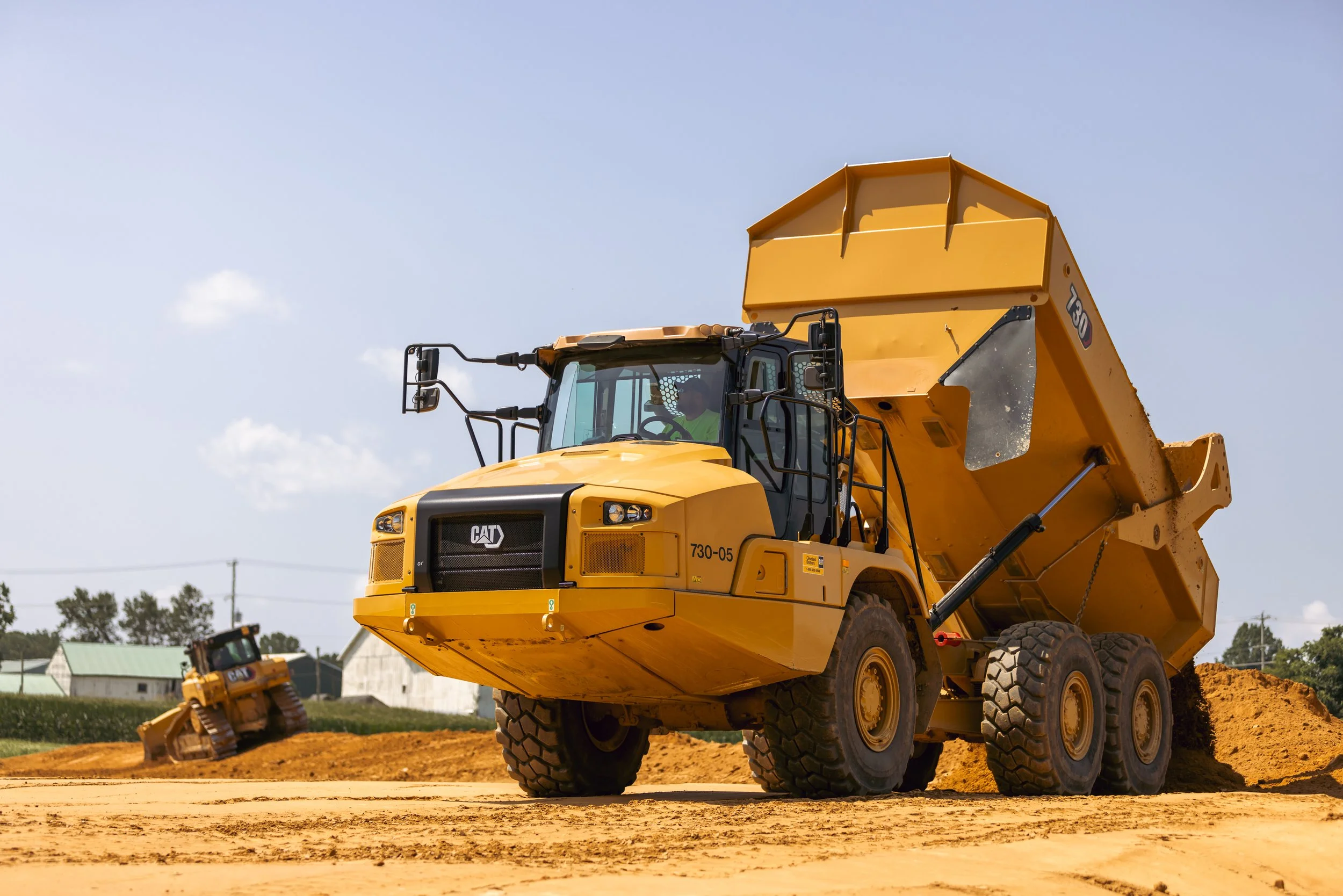 CAT 730 Dump Truck dumping dirt at the Brandywine Farms project