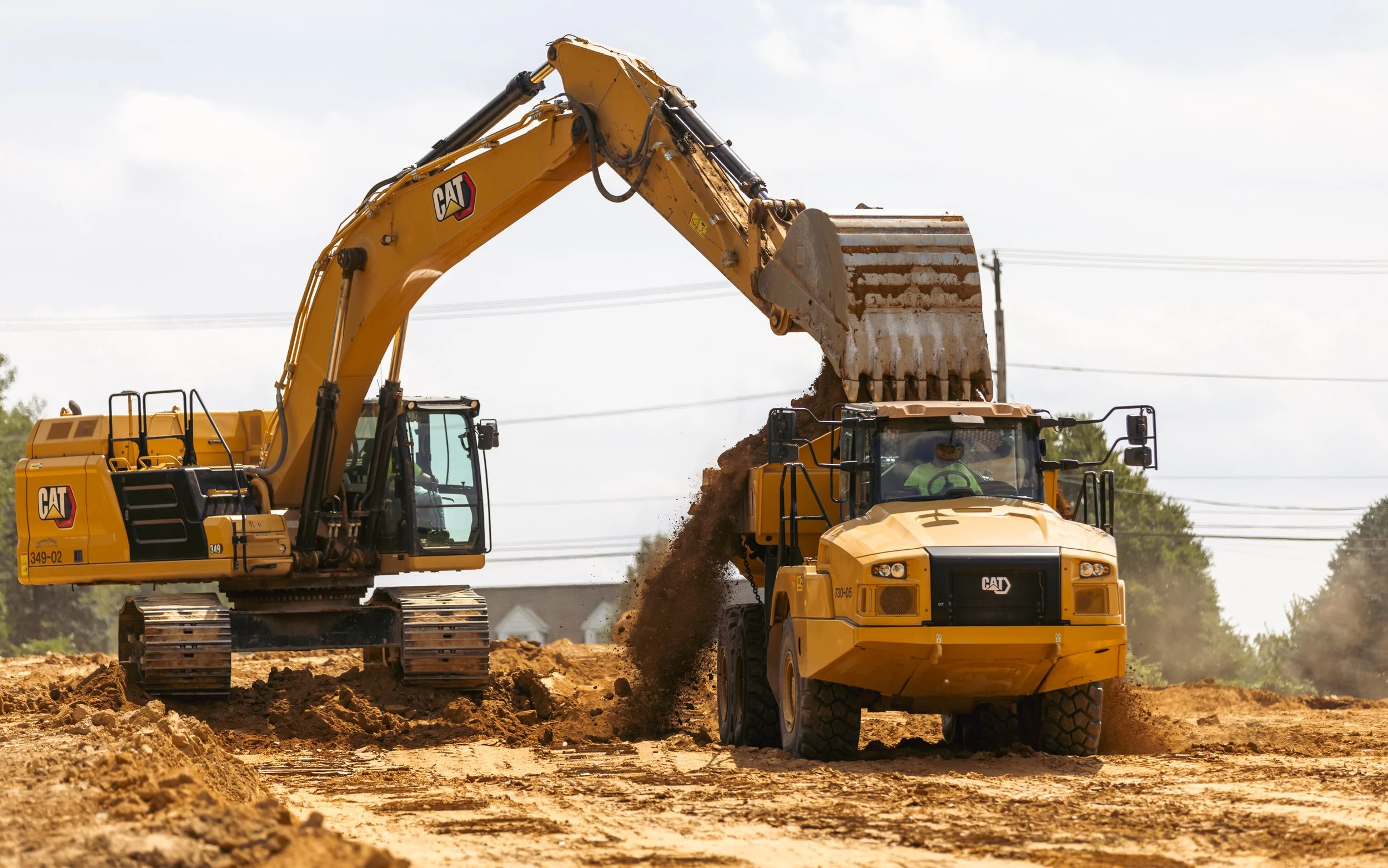 CAT 349 and 730 loading dirt at the Brandywine Farms project for Traditions of America