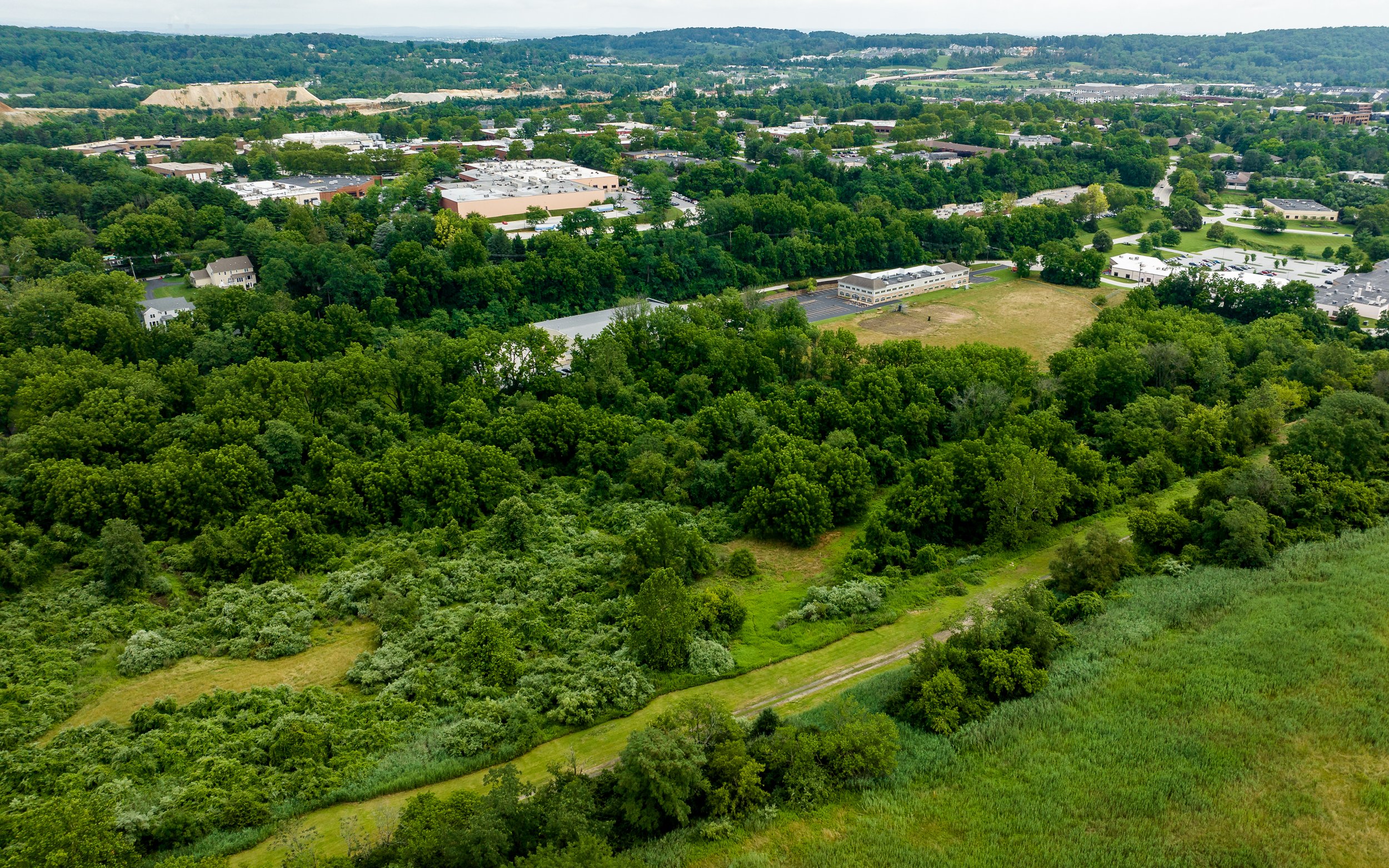 Aerial view of Anfield @ Malvern, a premier development in Chester County, showcasing the progress of the construction site near Route 29 and Route 202.