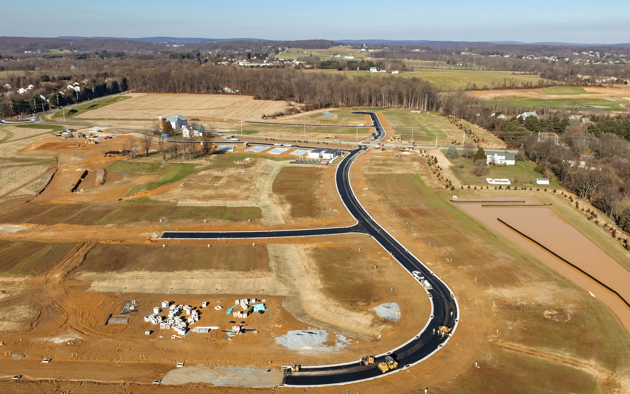 Asphalt blacktop being placed at our Brandywine Farms project.