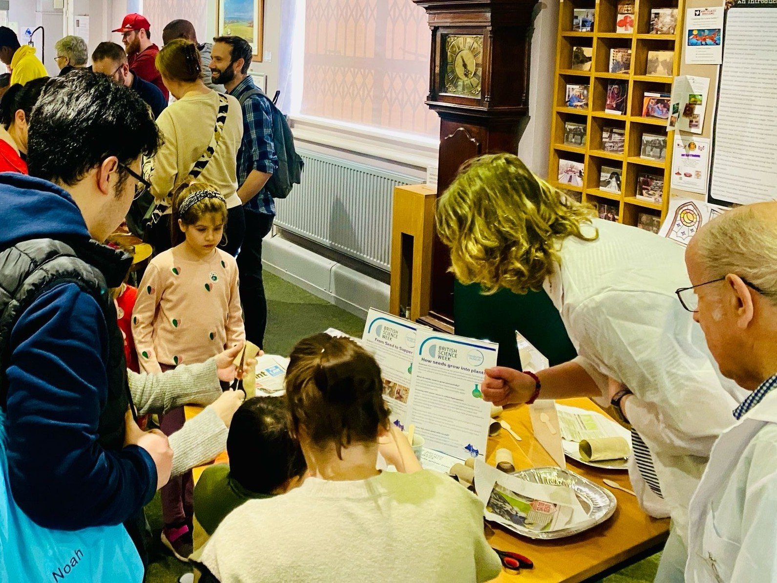 Children engaging with museum volunteers