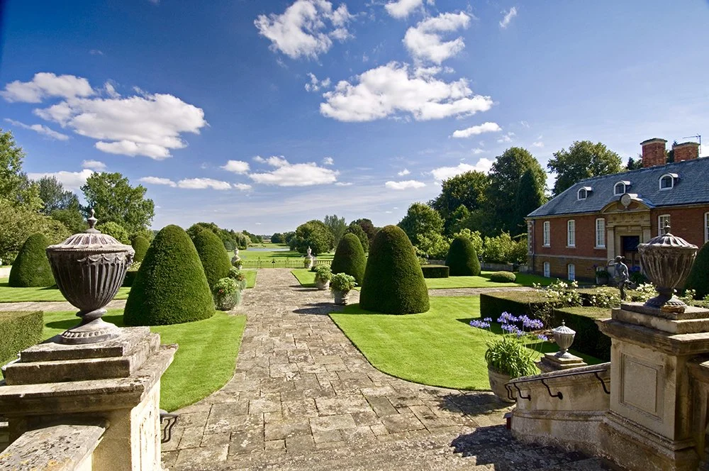 The south lawn with trees either side of the path