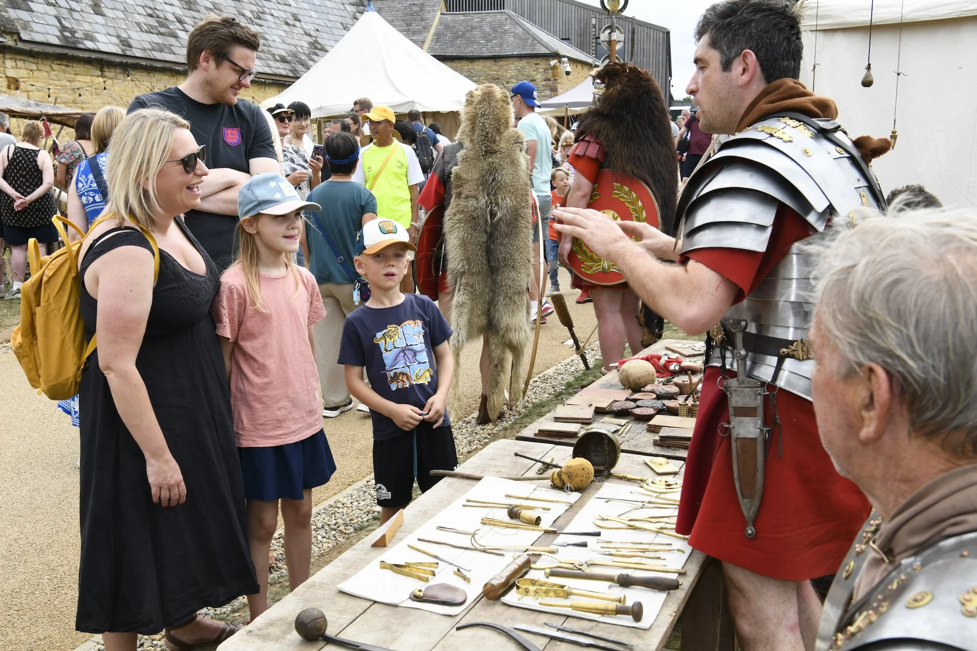A family talking to 'Roman soldiers' at last year's Roman Fest