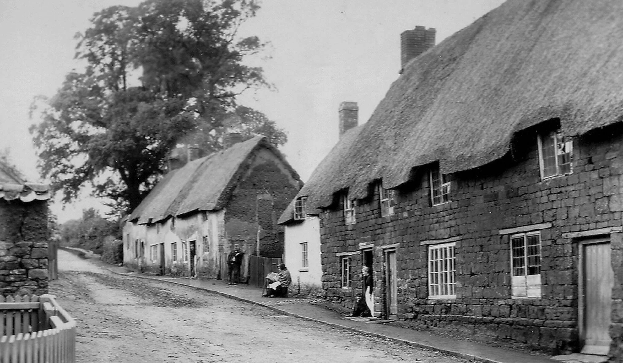 Lacemakers in Spratton outside cottages in Holdenby Road