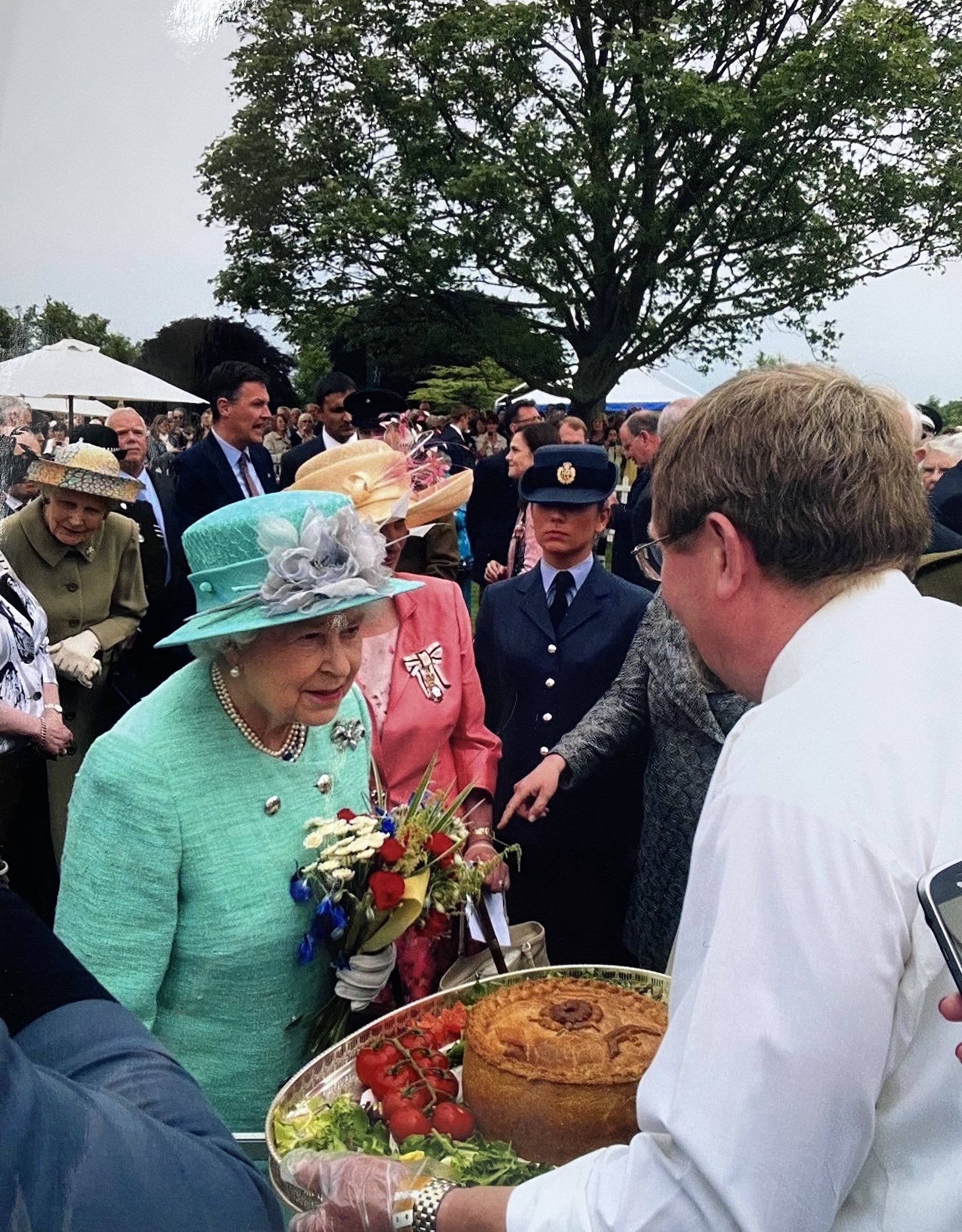 Chris Saul, the Spratton butcher presenting one of his pies to Her Majesty The Queen in 2020