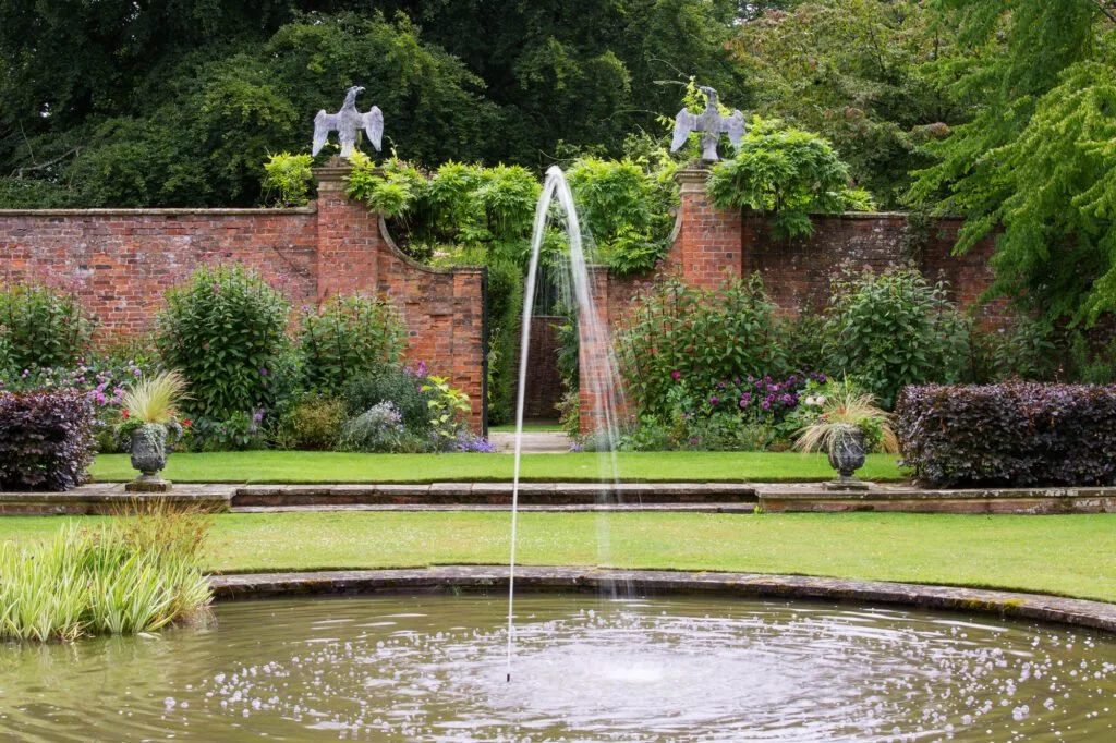 Fountains in the garden out of a circular pond
