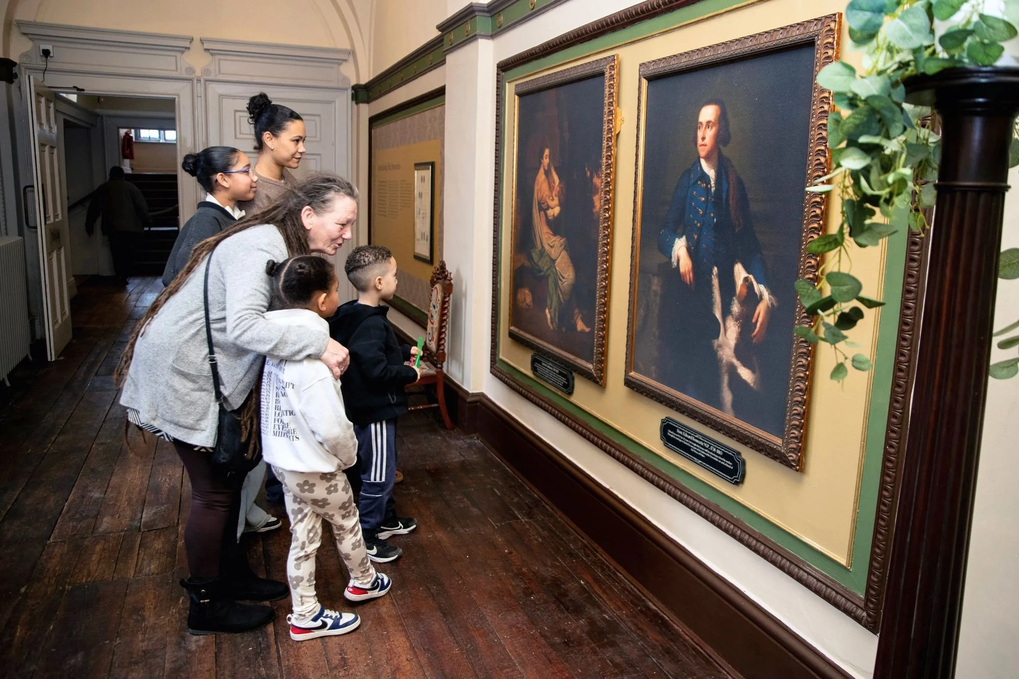 Families looking at the paintings