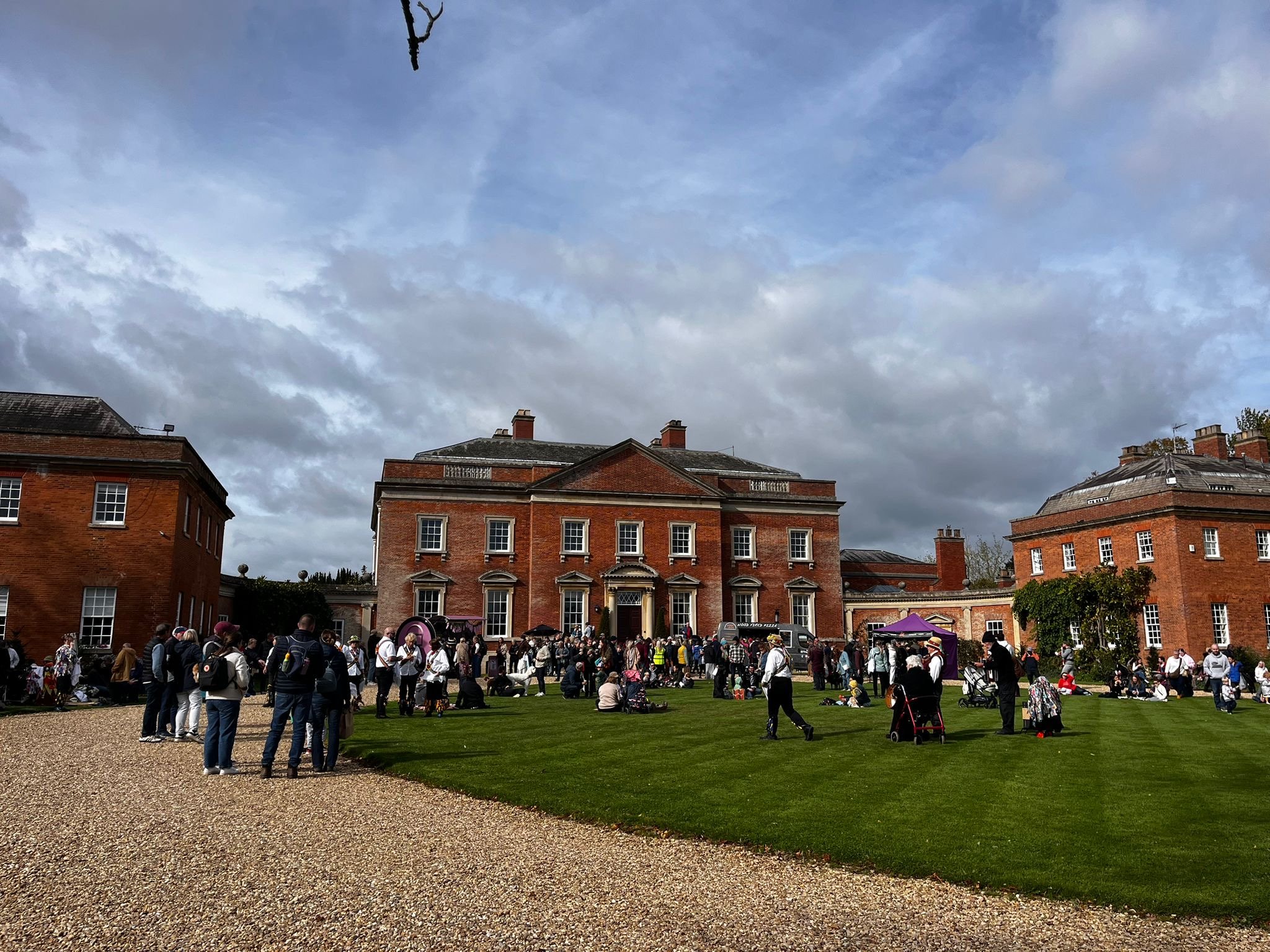 Families at the Autumn Walk at Kelmarsh in front of the house