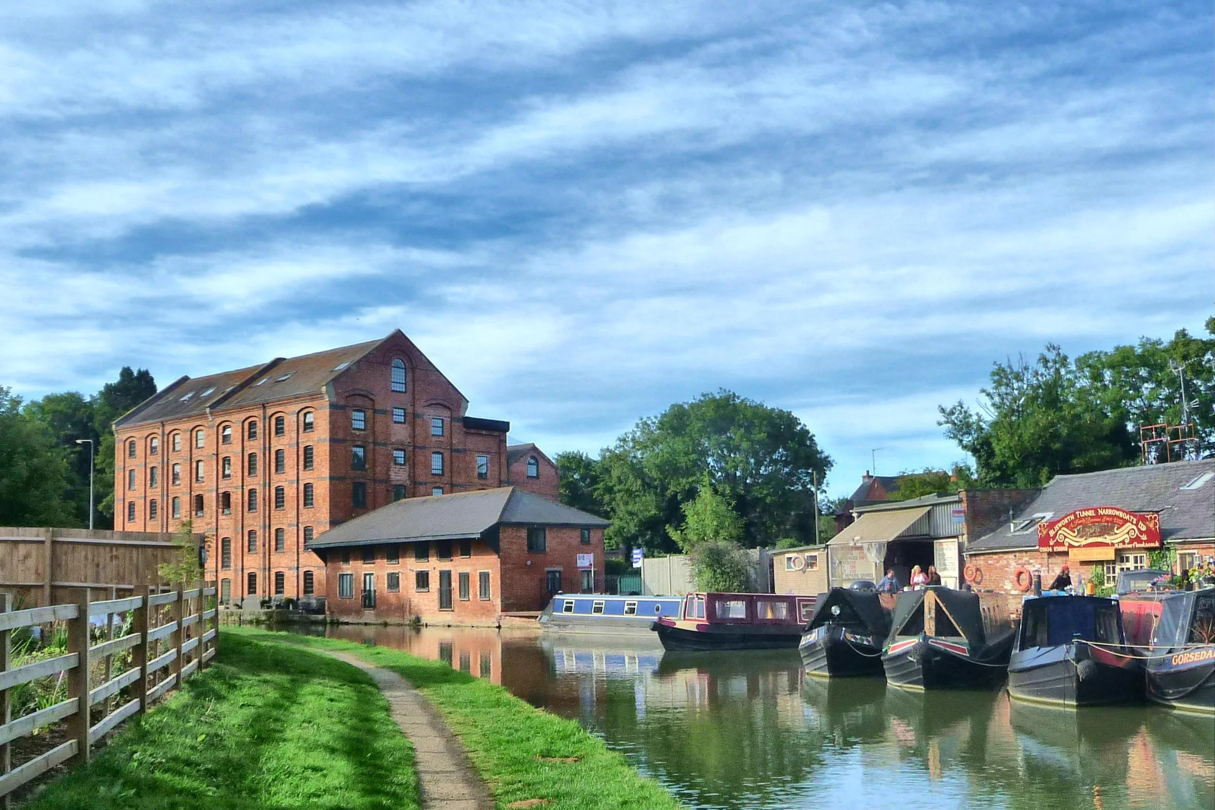 Blisworth Mill and the Grand Union Canal with narrowboats in the foreground