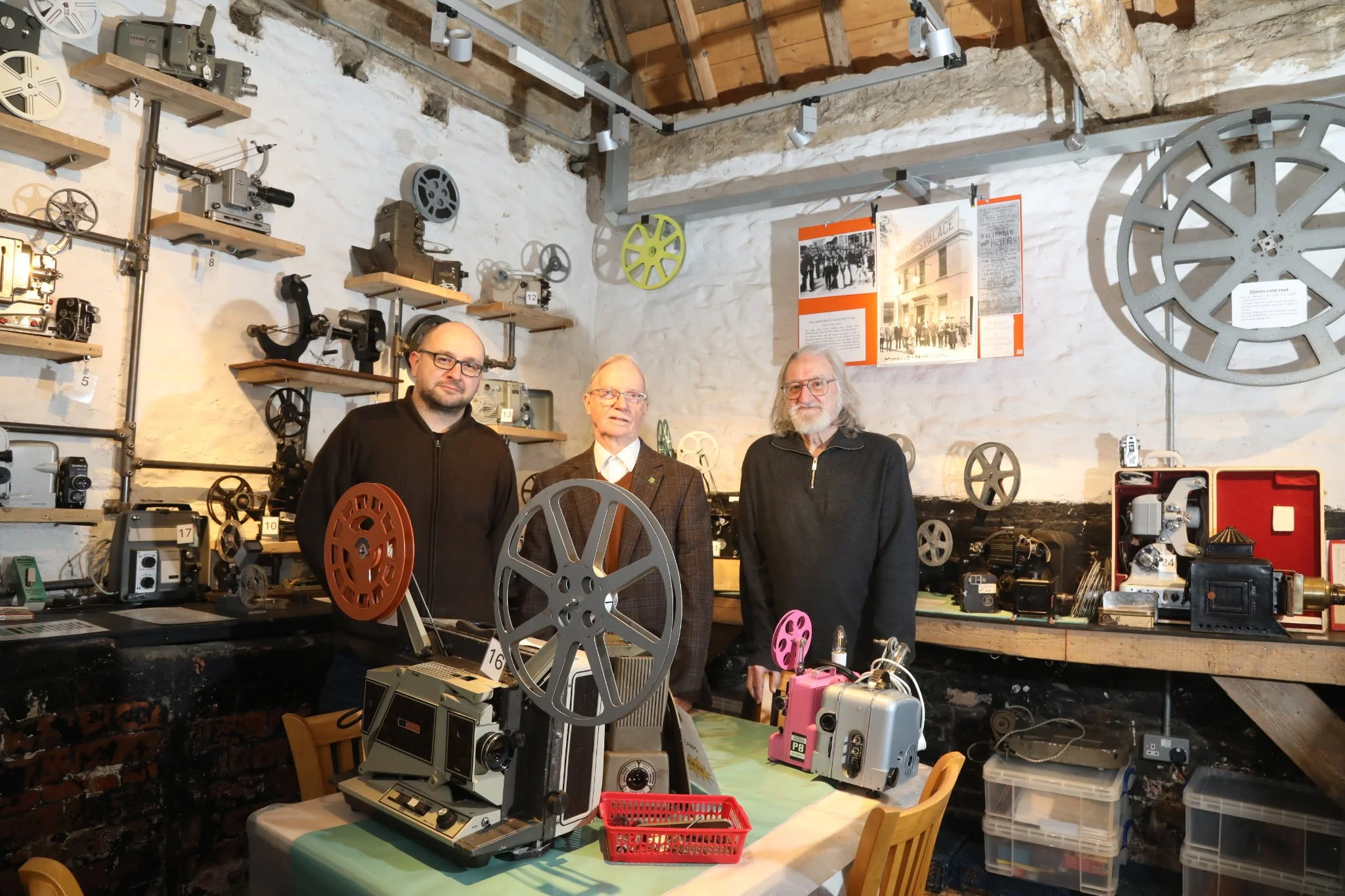 Film archivists with some equipment