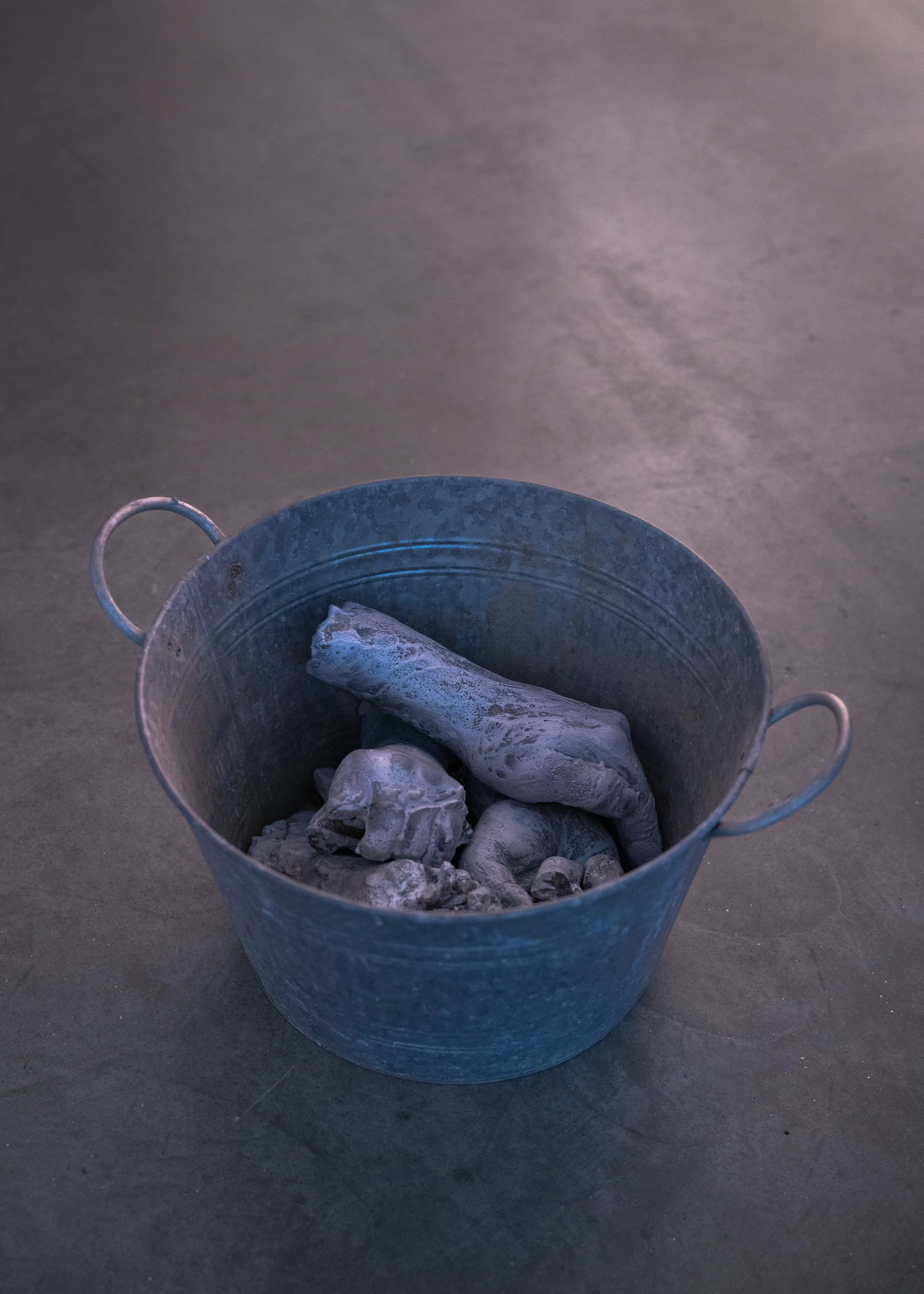 Bucket |  | aluminum, concrete, wax.  Photographed by Joel Tsui
