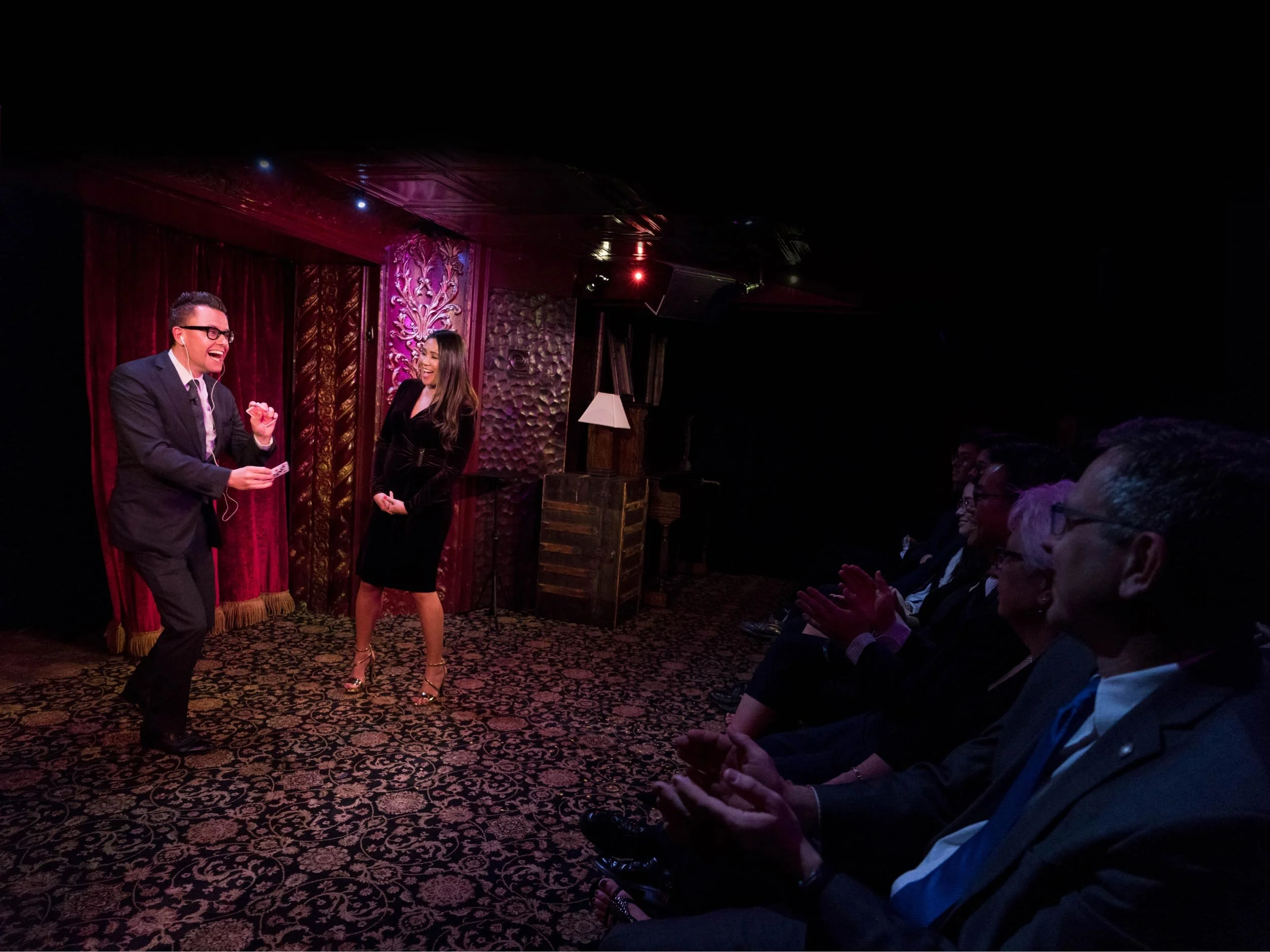 Arthur Trace on stage with a female volunteer at The Magic Castle's Peller Theater.