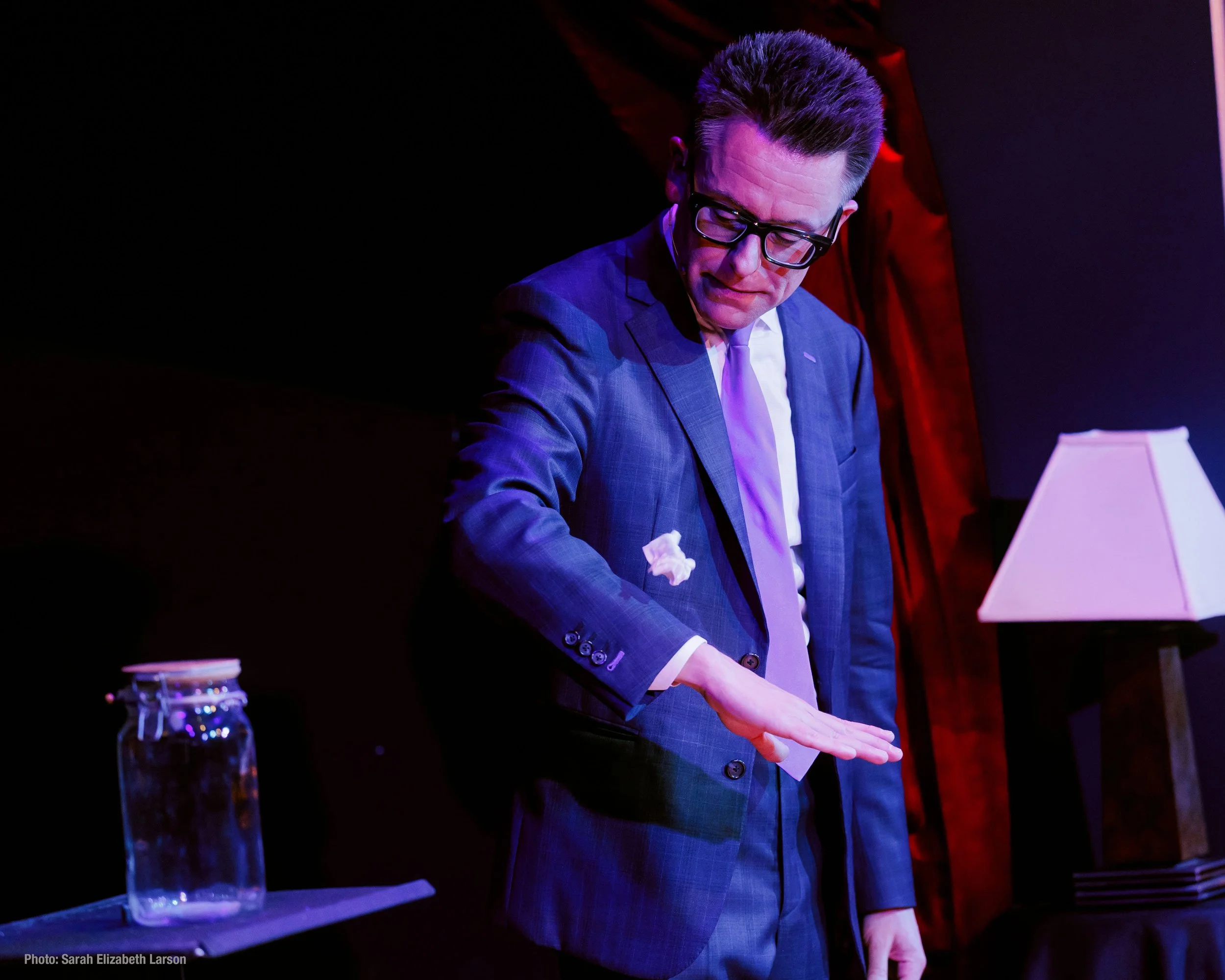 Arthur Trace makes a crumpled piece of paper float during his show.