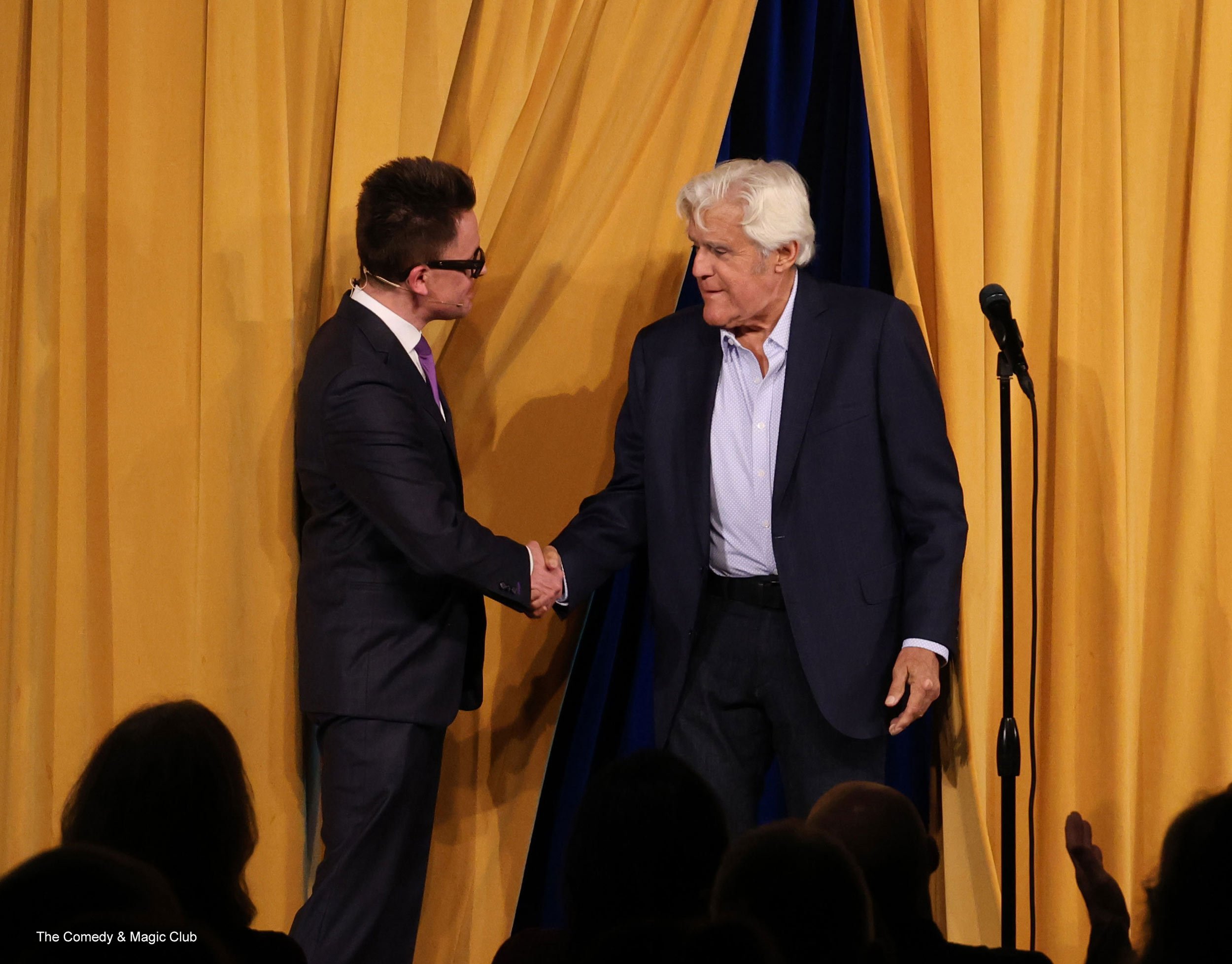 A photo of Arthur Trace and Jay Leno on stage at The Comedy & Magic Club.