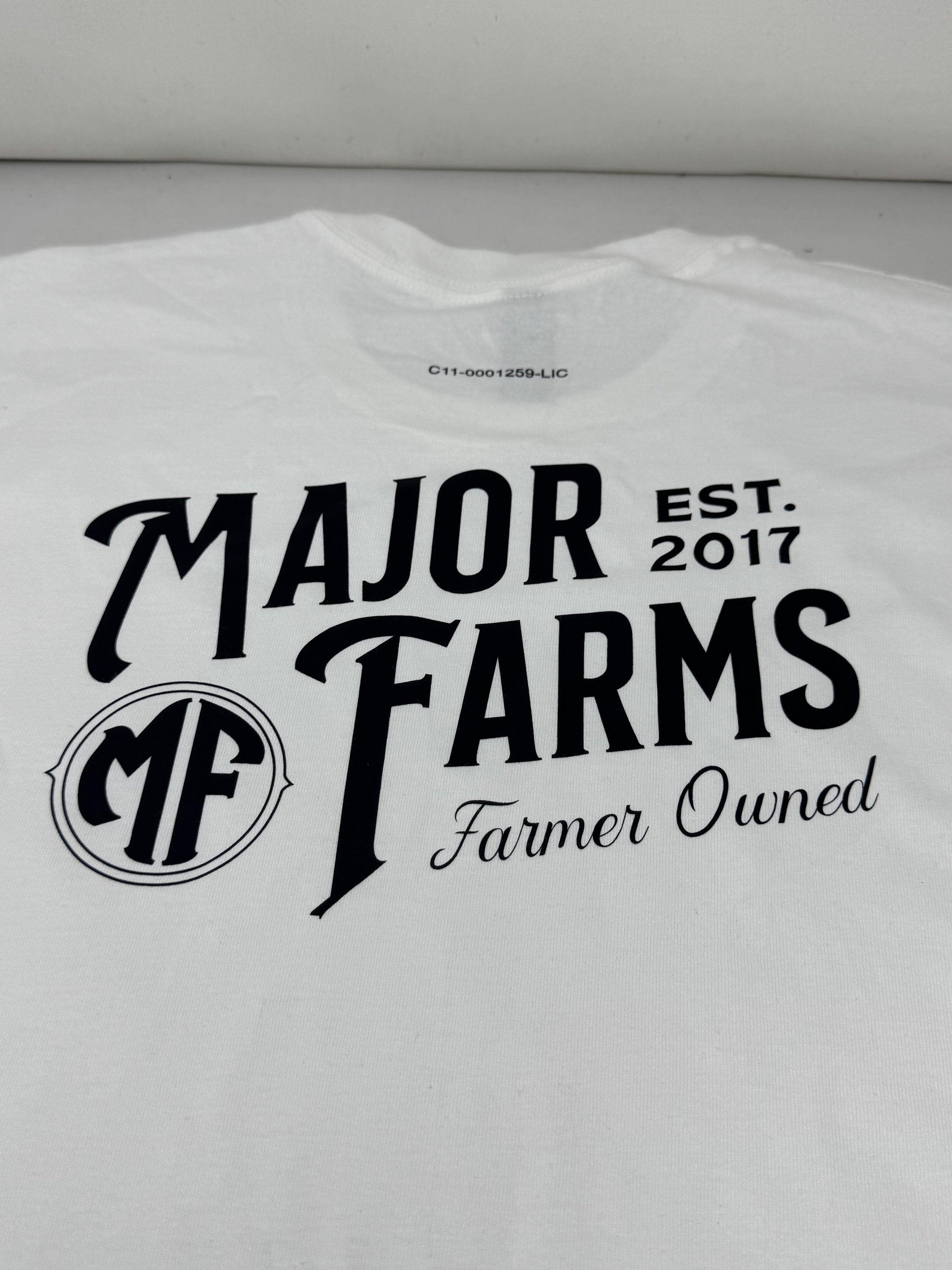MAJOR FARMS WHITE WITH BLACK LETTERS T-SHIRT Printed on front  and back license # printed on back neck