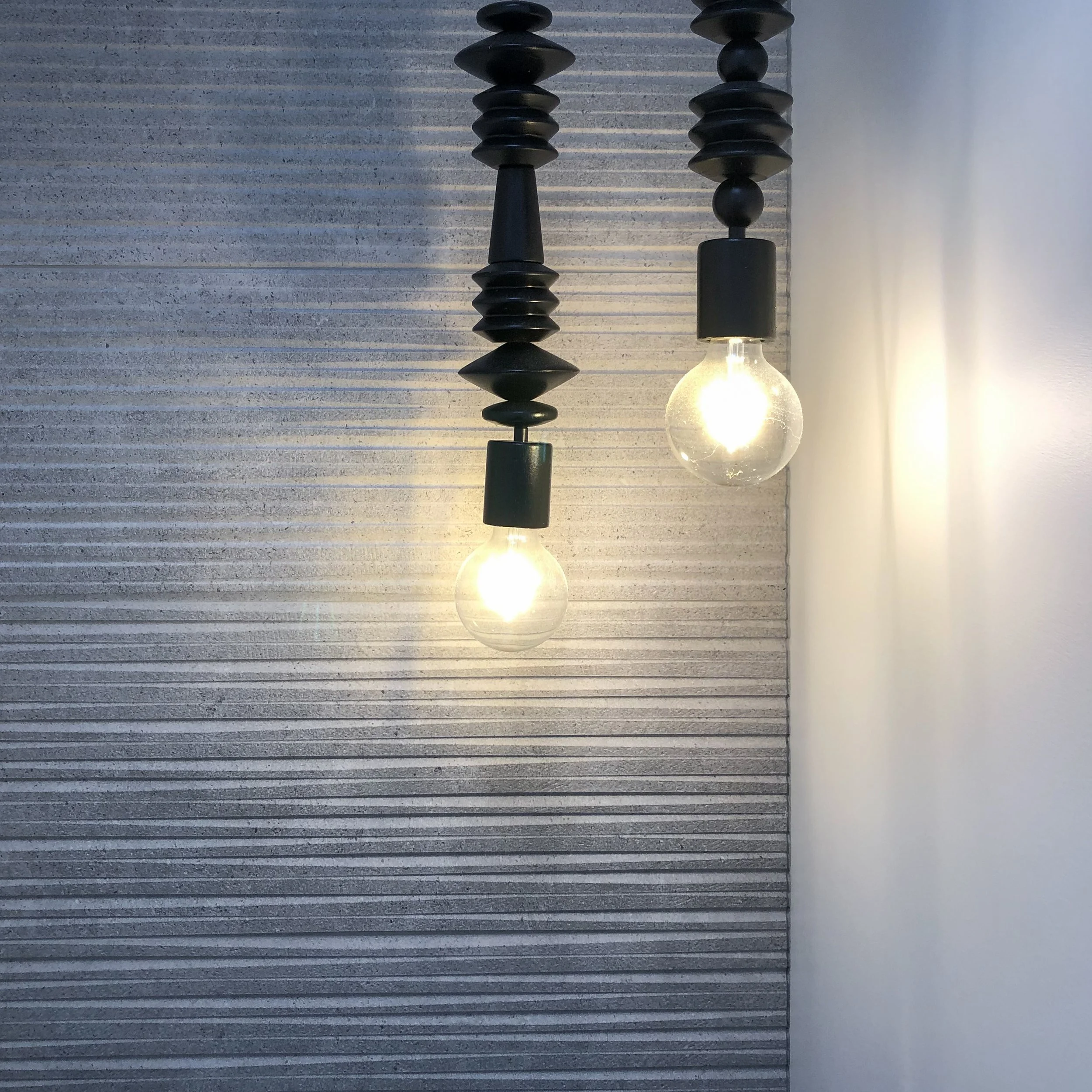 Bathroom lighting long sculptural pendants