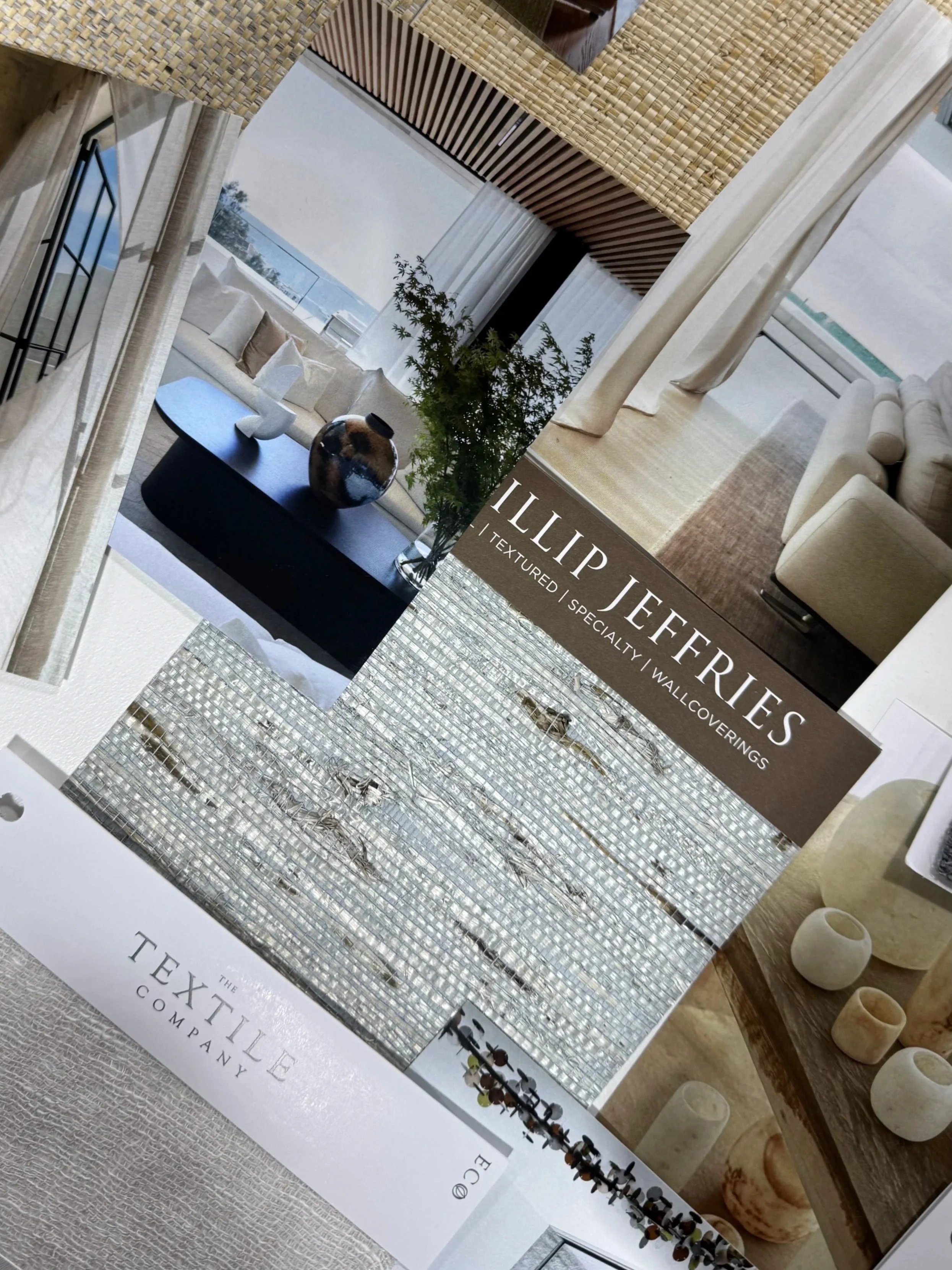 A selection of fabric swatches in various colors and patterns, including green, gold, black, brown, and striped designs, arranged on a display board.