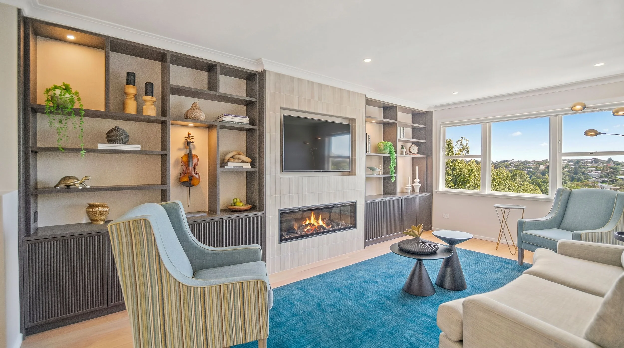 Bungalow lounge built in cabinetry , fireplace  , teal and grey colour scheme