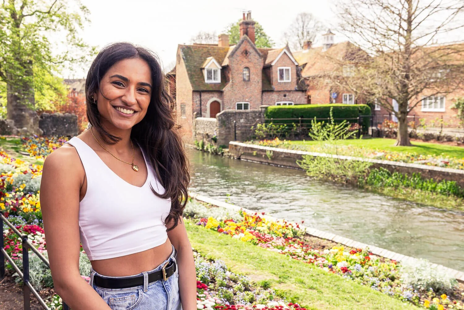Woman smiling at the camera in front of Westgate Garden