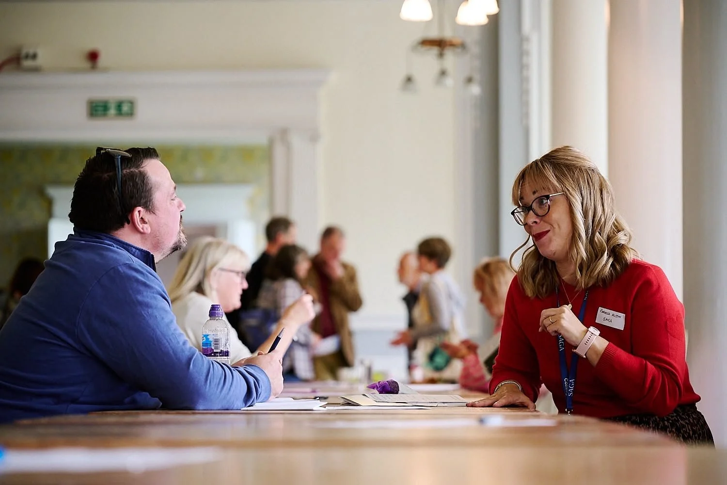 Man and woman smiling at a networking event