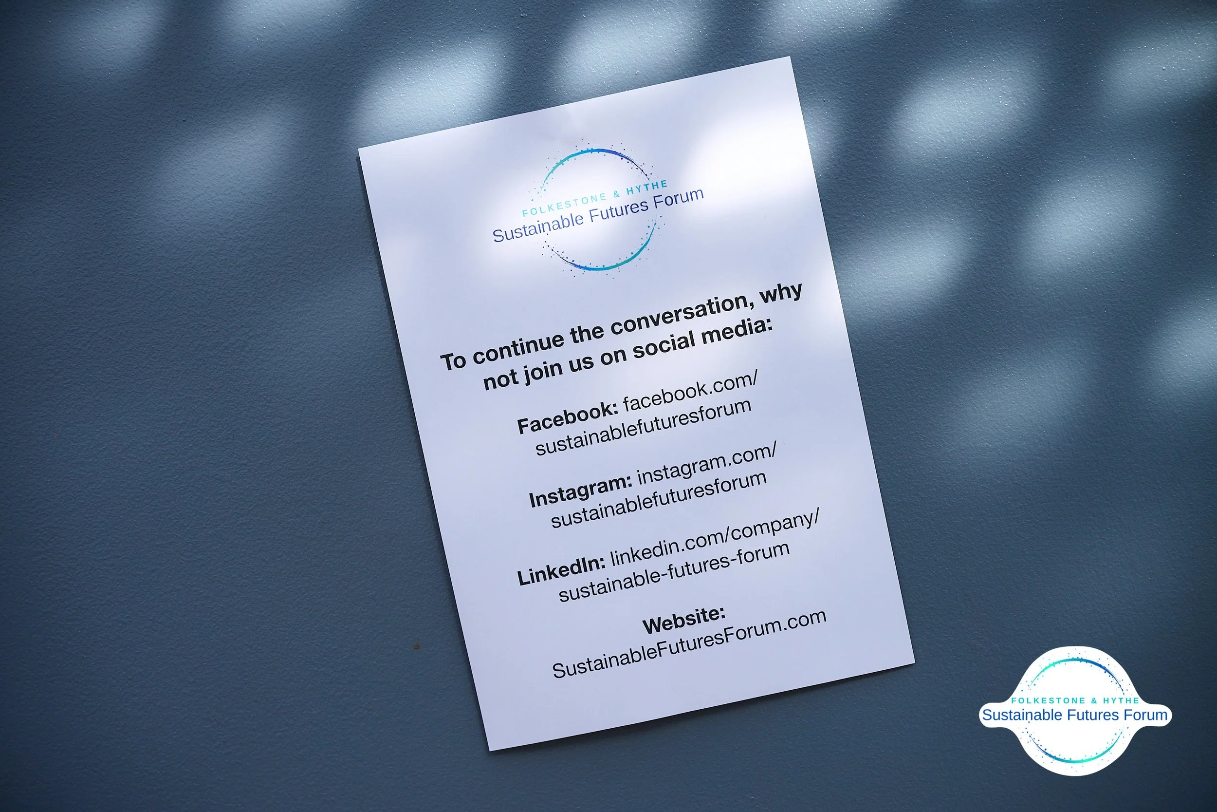 A printed flyer from the FolkeStone & Hythe Sustainable Futures Forum, inviting social media engagement via Facebook, Instagram, LinkedIn, and the forum's website.
