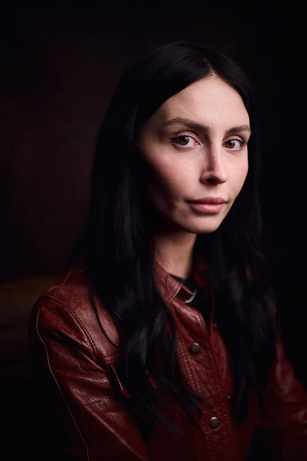 Woman smiling with leather jacket