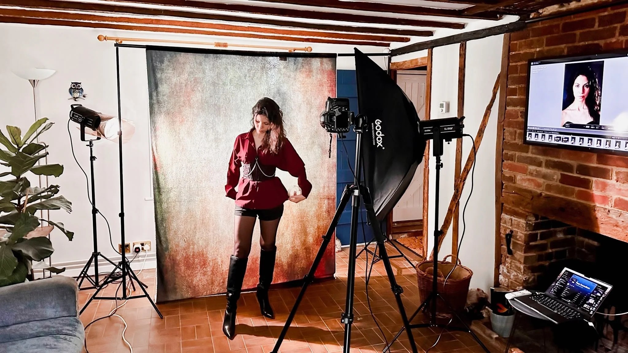 Model standing in a home studio against a backdrop
