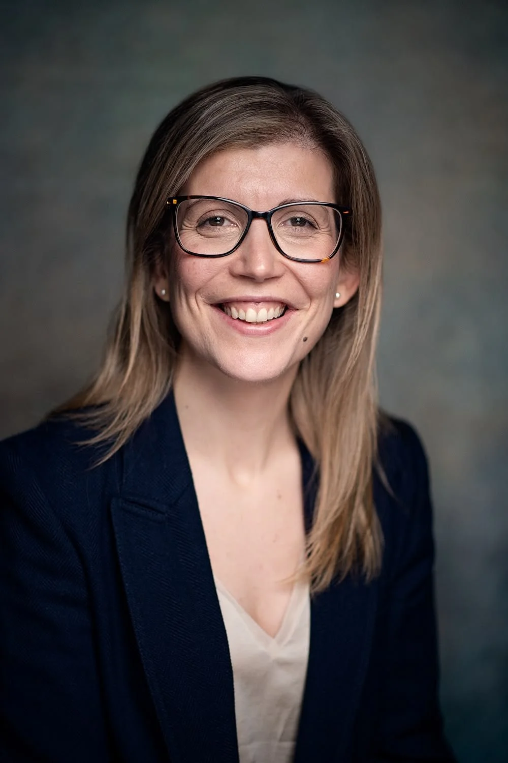 Blonde woman smiling at the camera