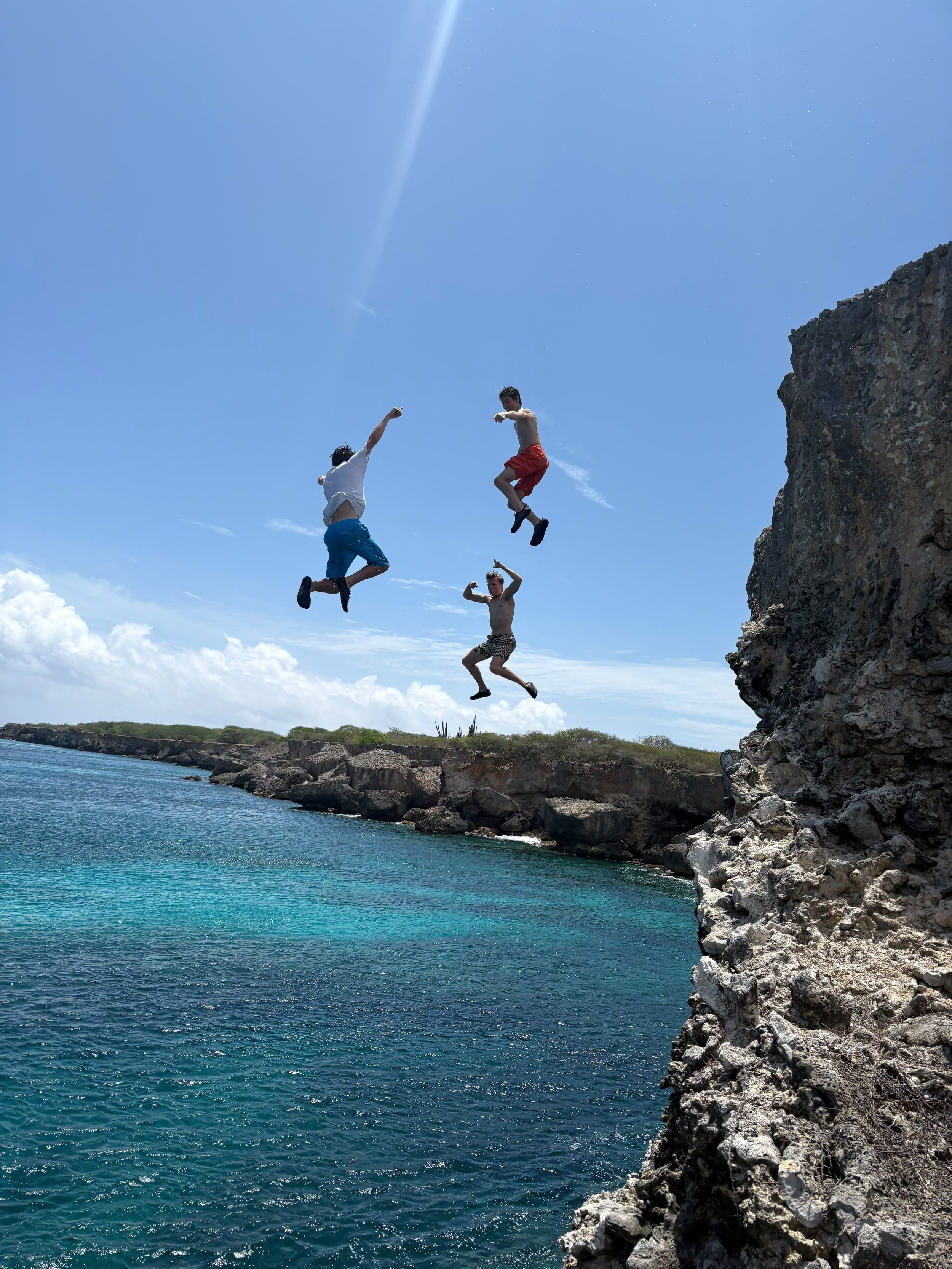 Cliff jump into the Caribbean Sea