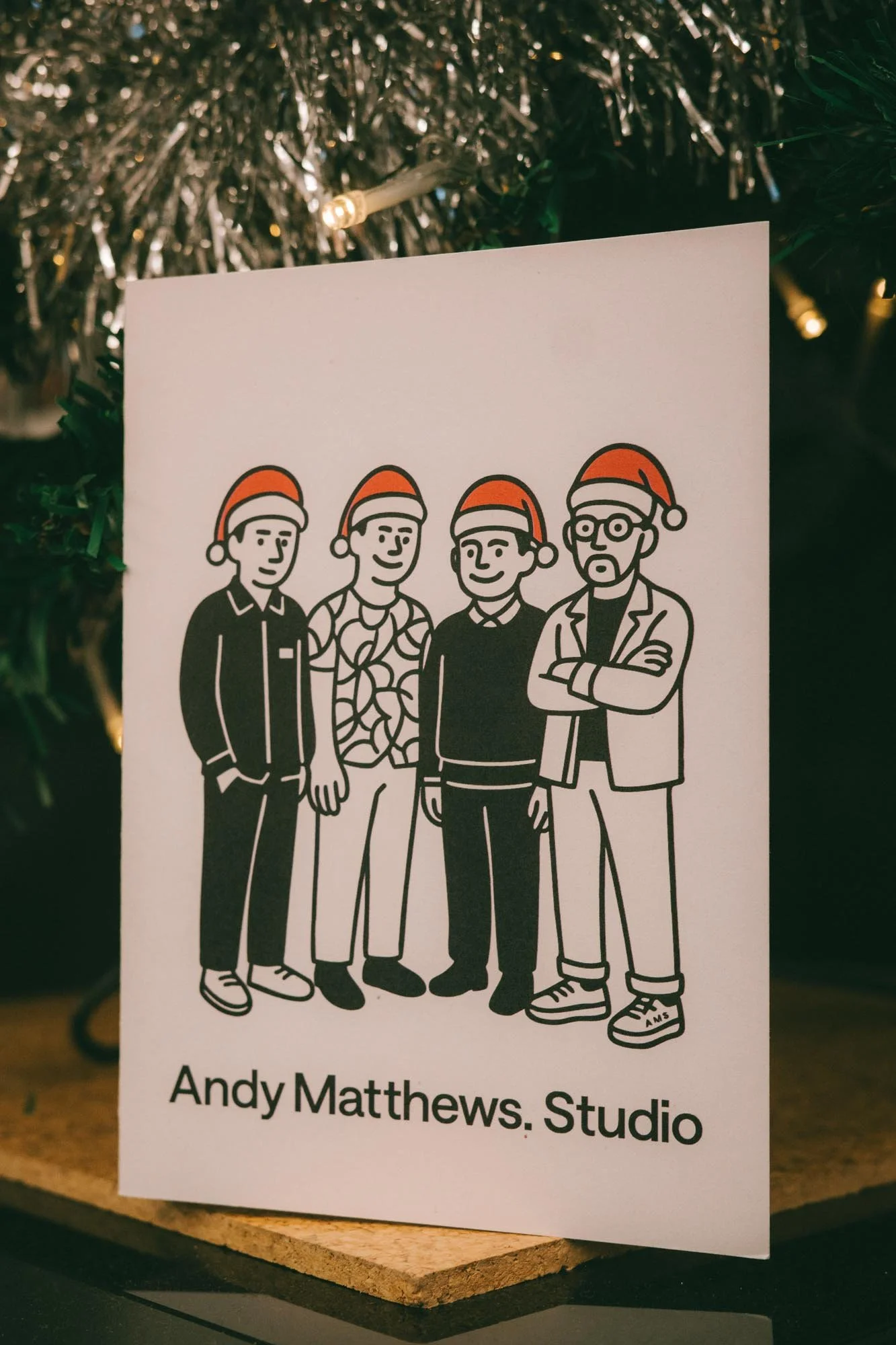 Christmas card with four architects in a black illustration style