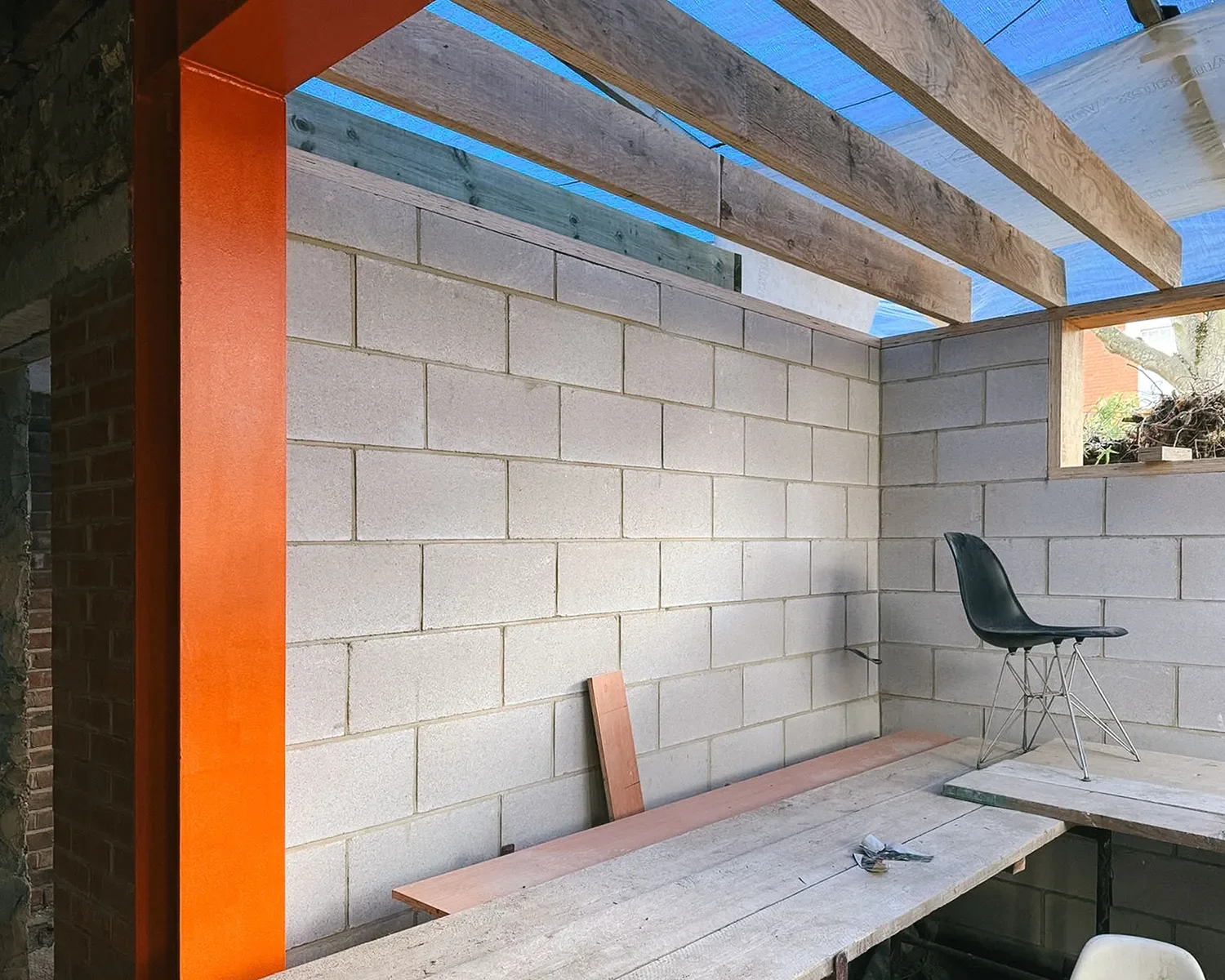 During construction. Recycled steel in foreground and LVL timber joists being installed. © Andy Matthews Studio