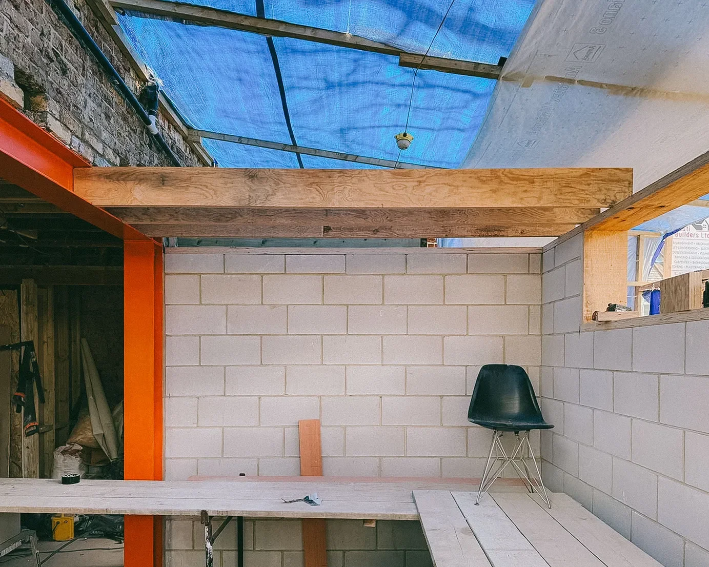 During construction. Recycled steel in foreground and LVL timber joists being installed. © Andy Matthews Studio