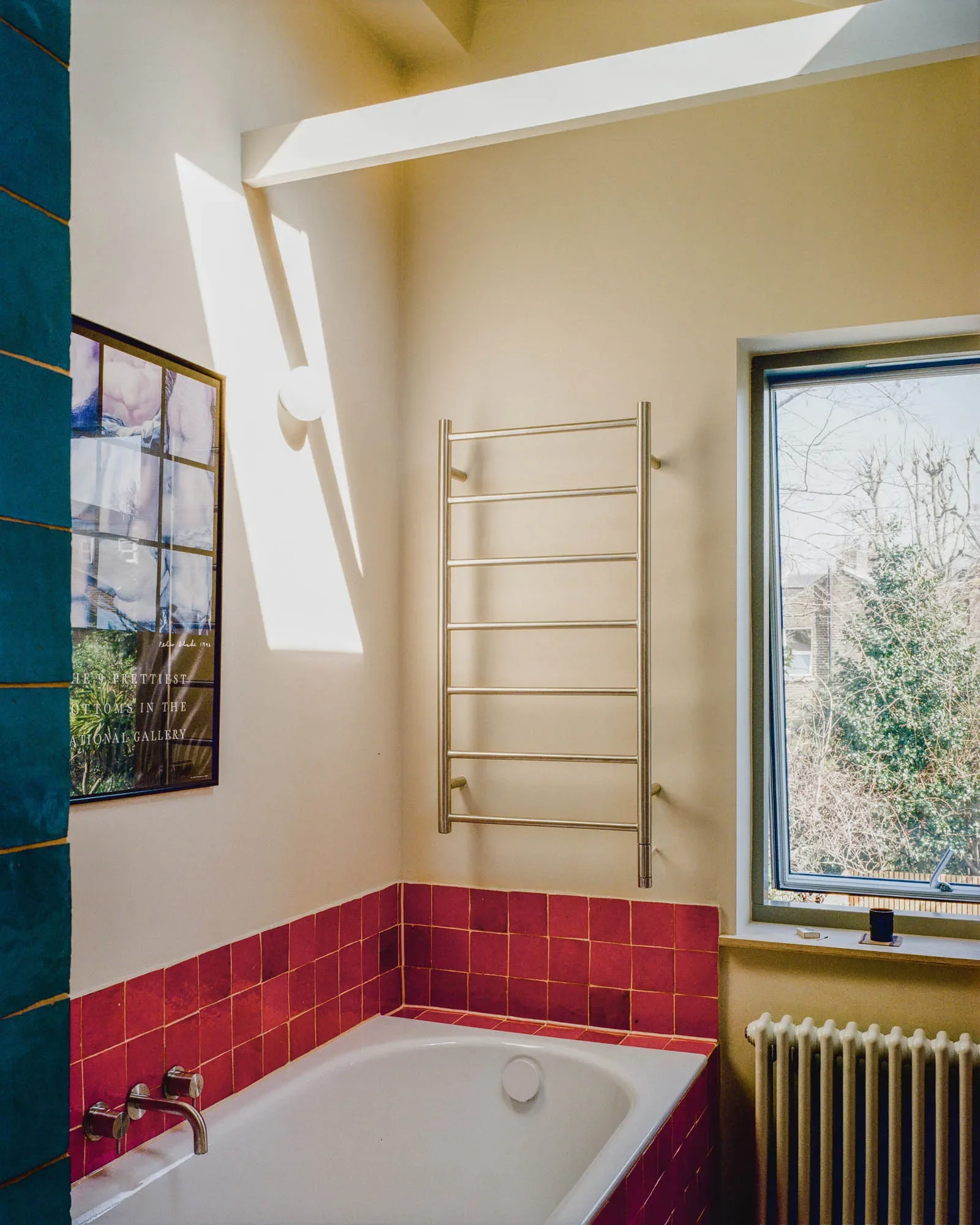 View of bathroom with daylight through the new rooflights © Owen Vidler
